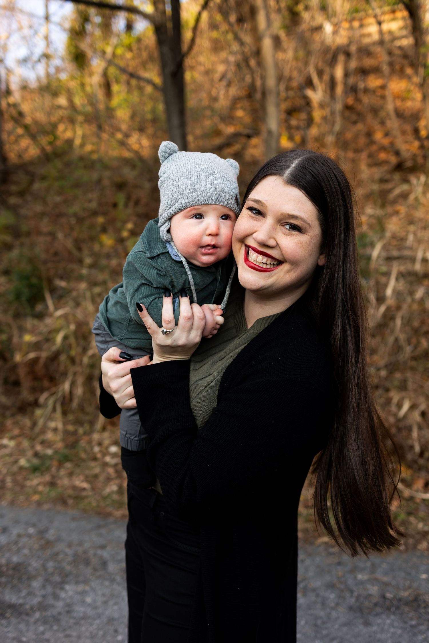Woman holding child wearing a bear hat