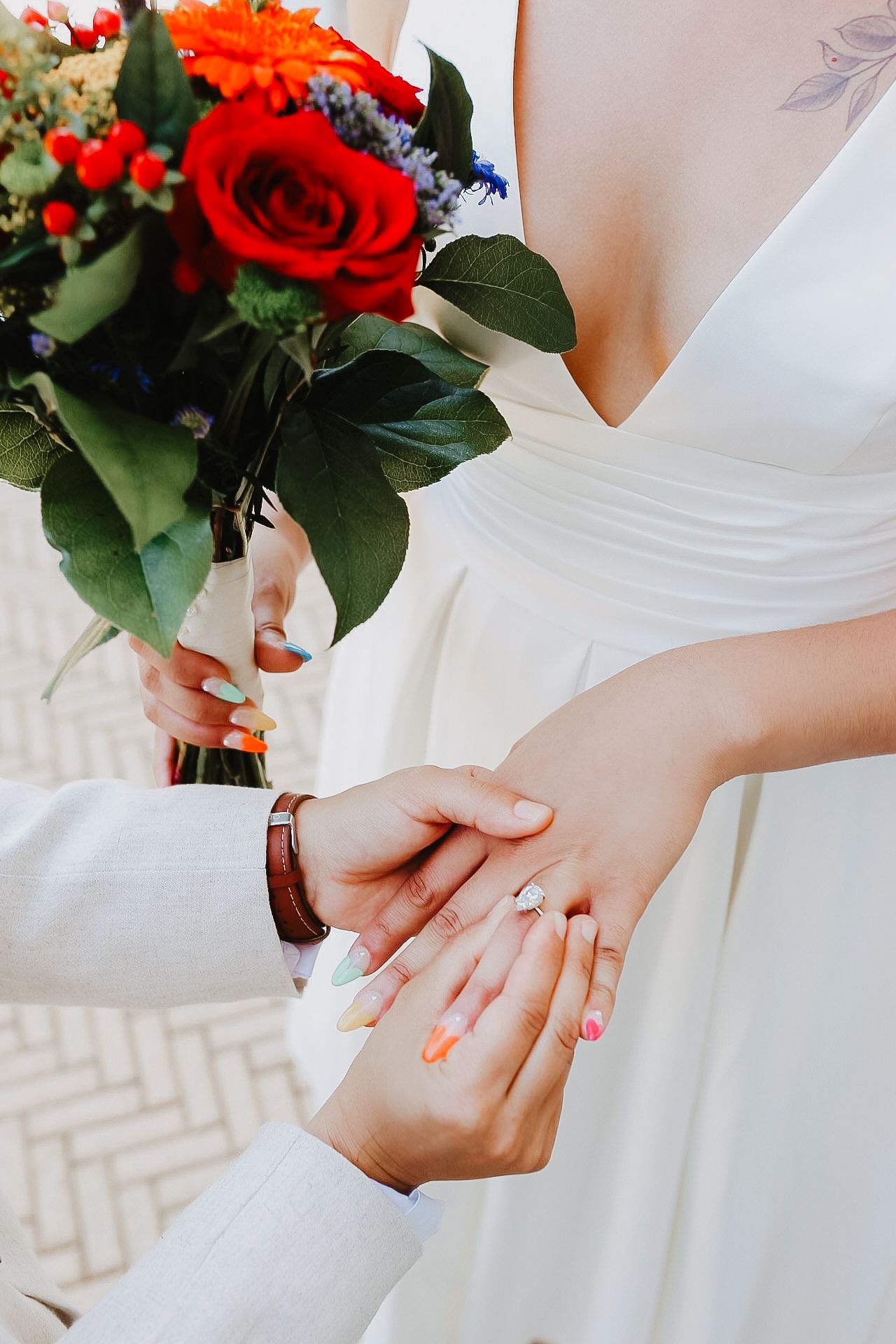 Editorial close up of wedding rings and bouquet in Hoover, AL with bright tones and pure whites