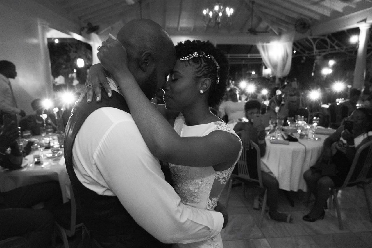 Couple embracing under string lights in Bethlehem PA, artistic documentary dance photo