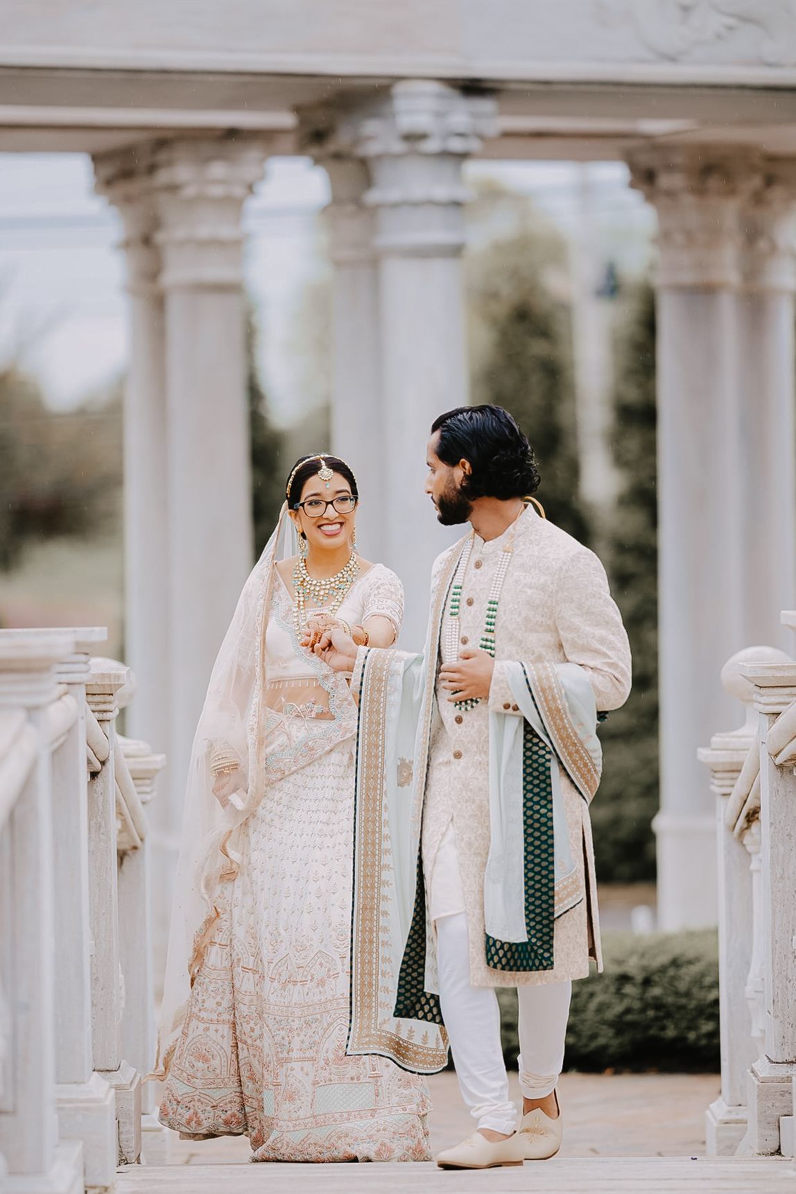 Indian Wedding Ceremony in Philadelphia PA editorial style with bright airy whites and muted greens.
