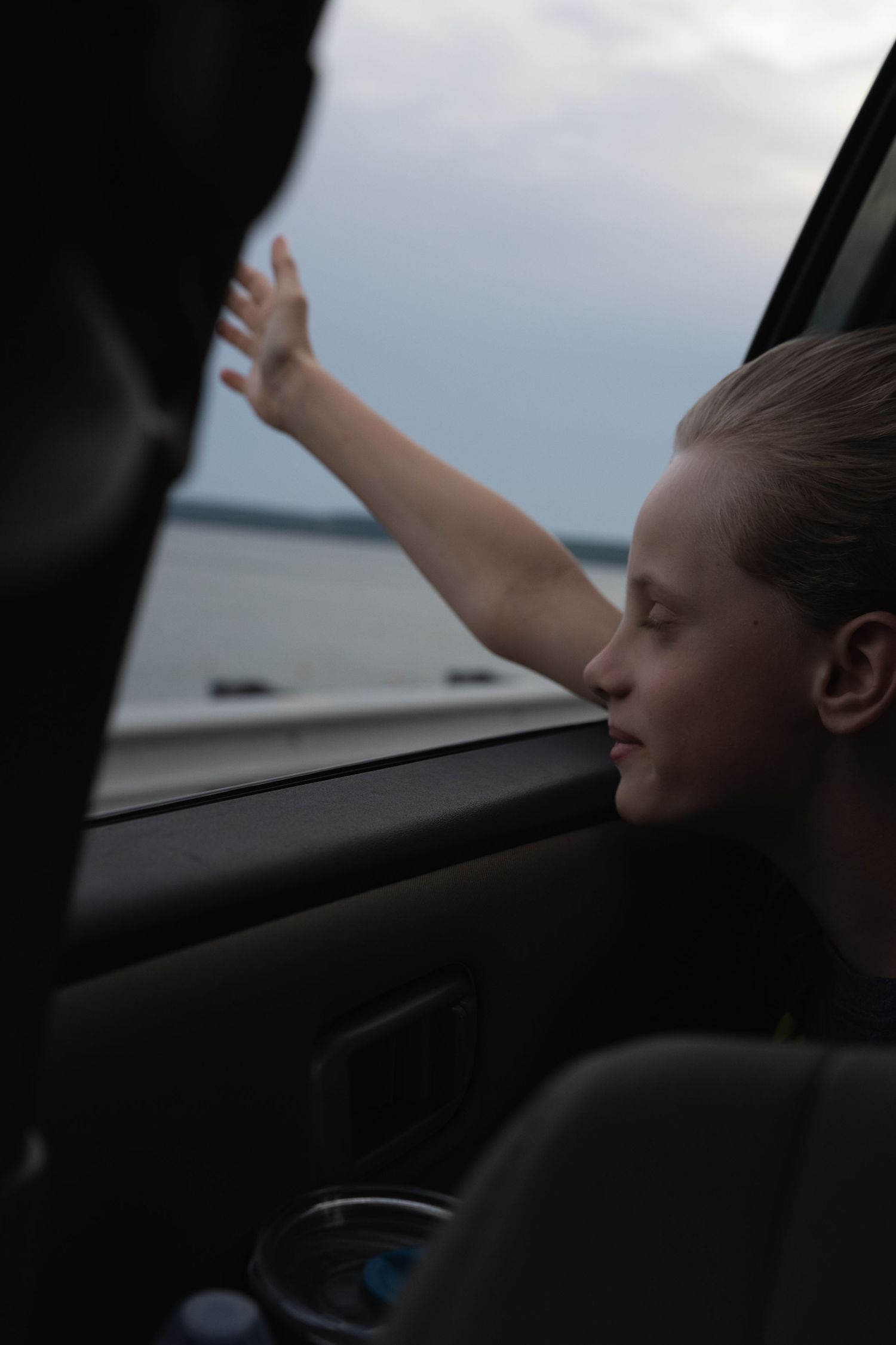Child reaching out car window by Tulsa Photographers, Cristin Franks Photography