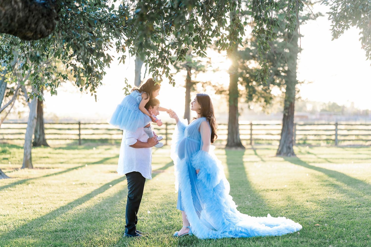 Romantic engagement photo session in a sunlit park with a couple posing together.