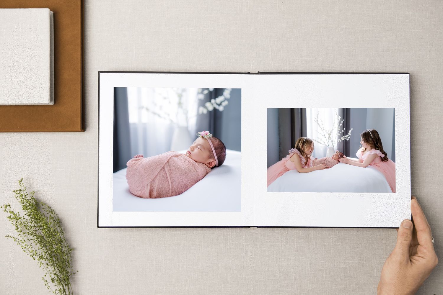 Photo album showing beautiful maternity photography session in soft pink tones.