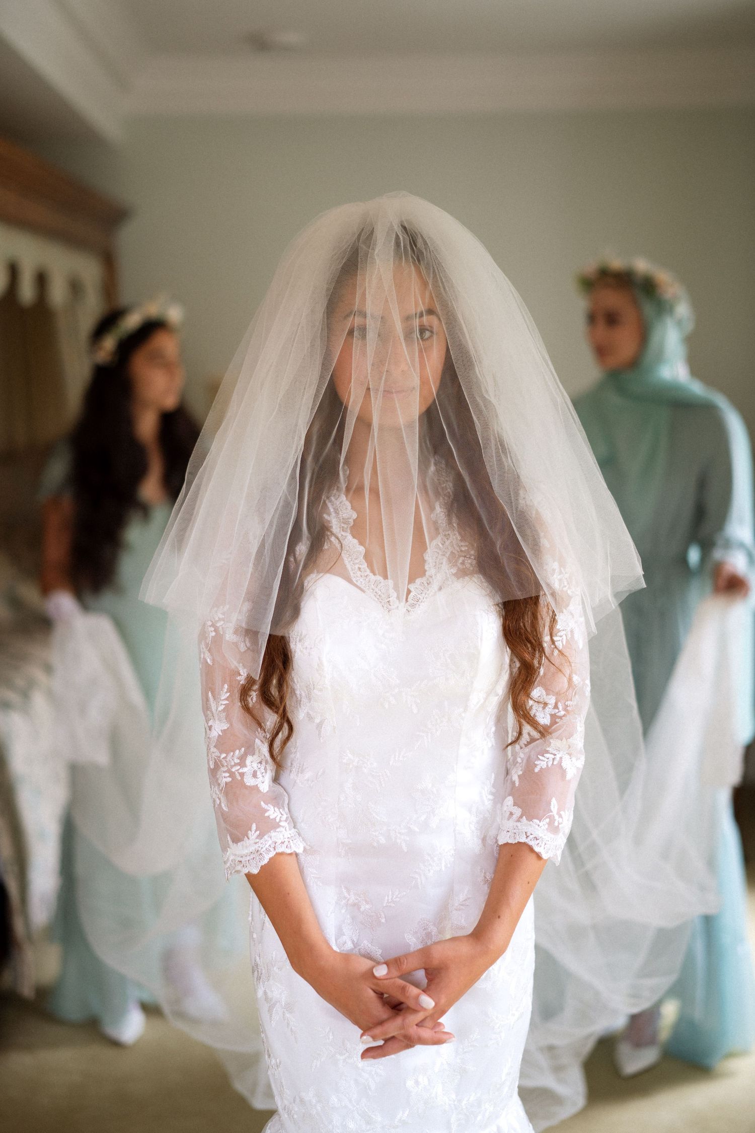 A bridal preparation moment captured in soft natural light.