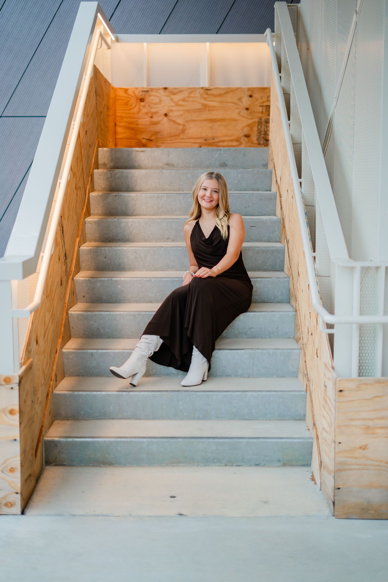 Senior session in bentonville Arkansas on stairs near crystal bridges by best photographer in Bentonville Arkansas