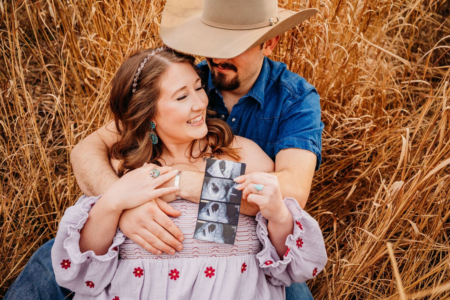 pregnancy announcement couples shoot near Thaden Field in Bentonville, arkansas. Maternity photoshoot in a golden field.