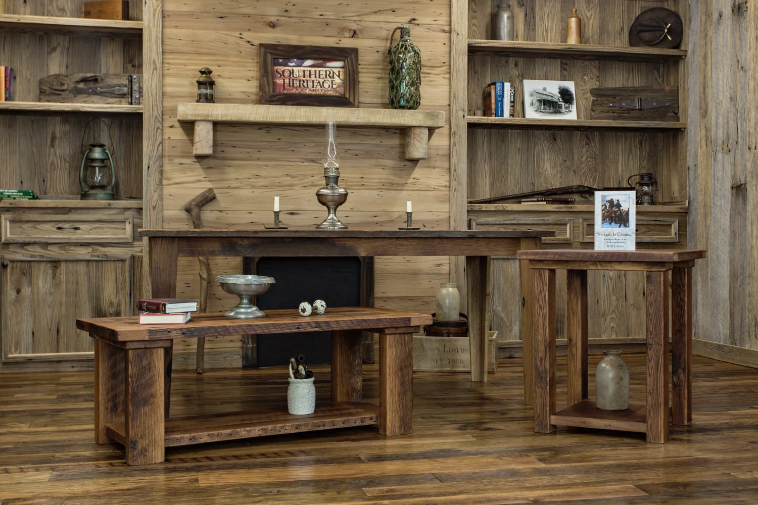 Rustic wooden living room furniture set with shelving units and coffee table against wood-paneled wall with decorative items.