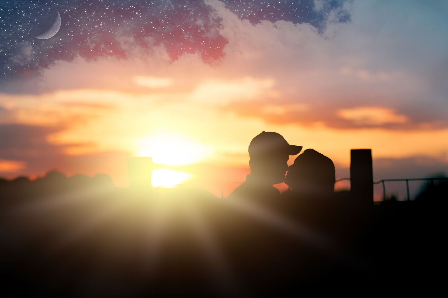 Silhouette of farm buildings and figures against a dramatic sunset sky with a crescent moon.