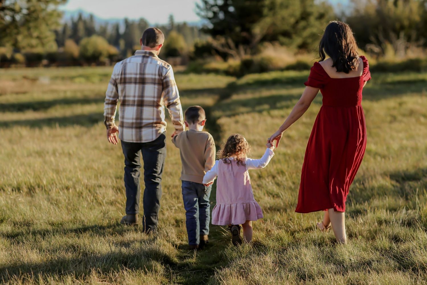 family-walking-holding-hands-black-butte-ranch-bend-oregon