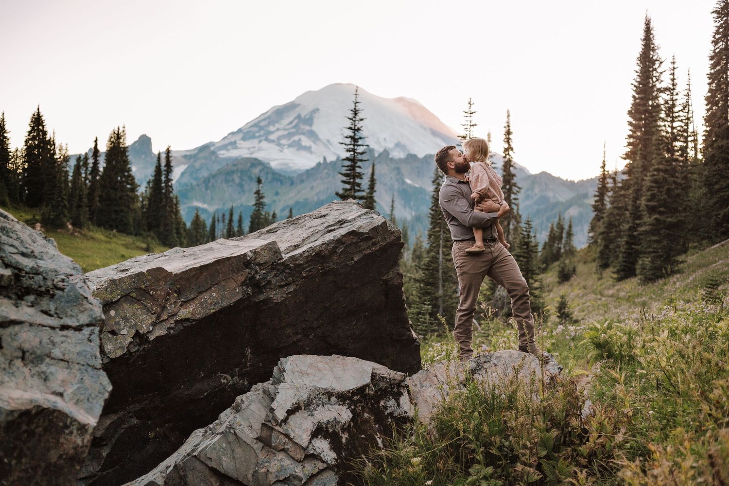 Family photography session at Mt. Rainier National Park, Dad and daughter share a hug