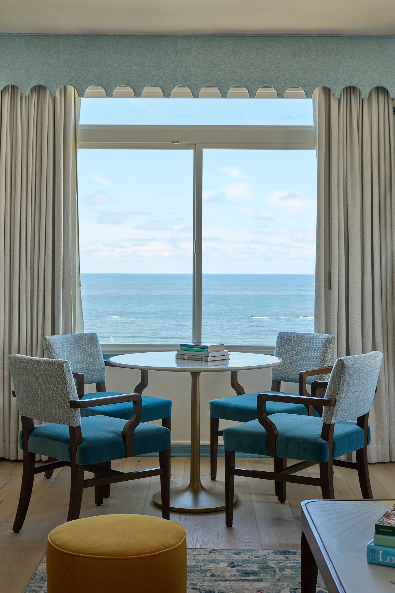 The guestroom at the Georgian Hotel in Santa Monica, LA. Interior Design by Fettle Design. Ocean view from the dining table