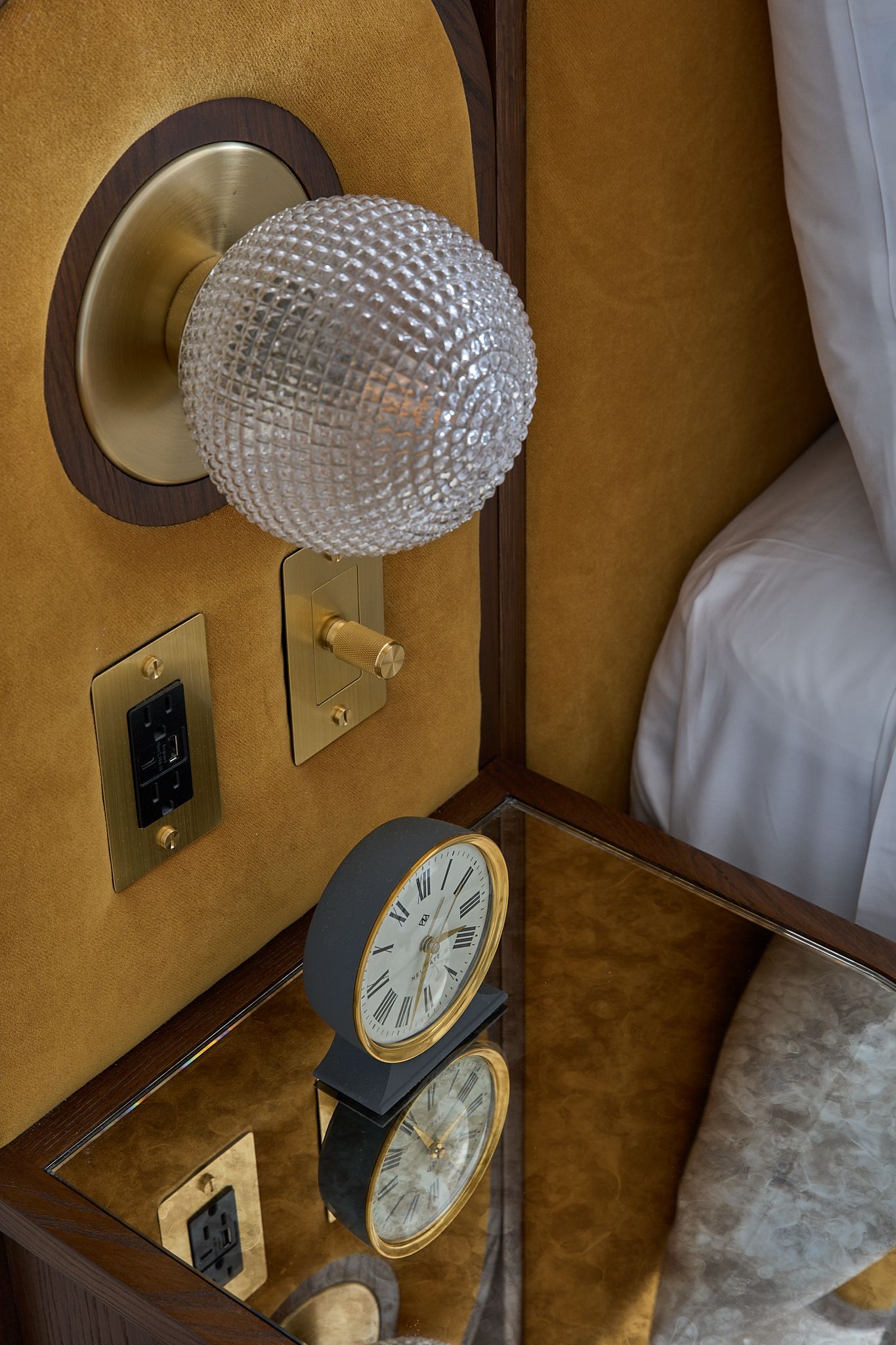 The guestroom at the Georgian Hotel in Santa Monica, LA. Interior Design by Fettle Design. Yellow fabric and nightstand