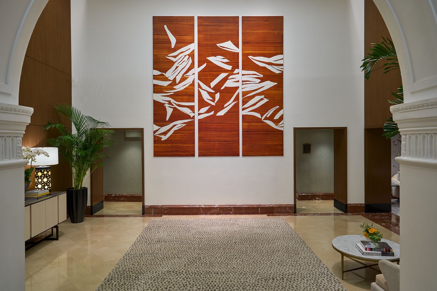 The lobby at the Peninsula hotel in NY with large red artwork