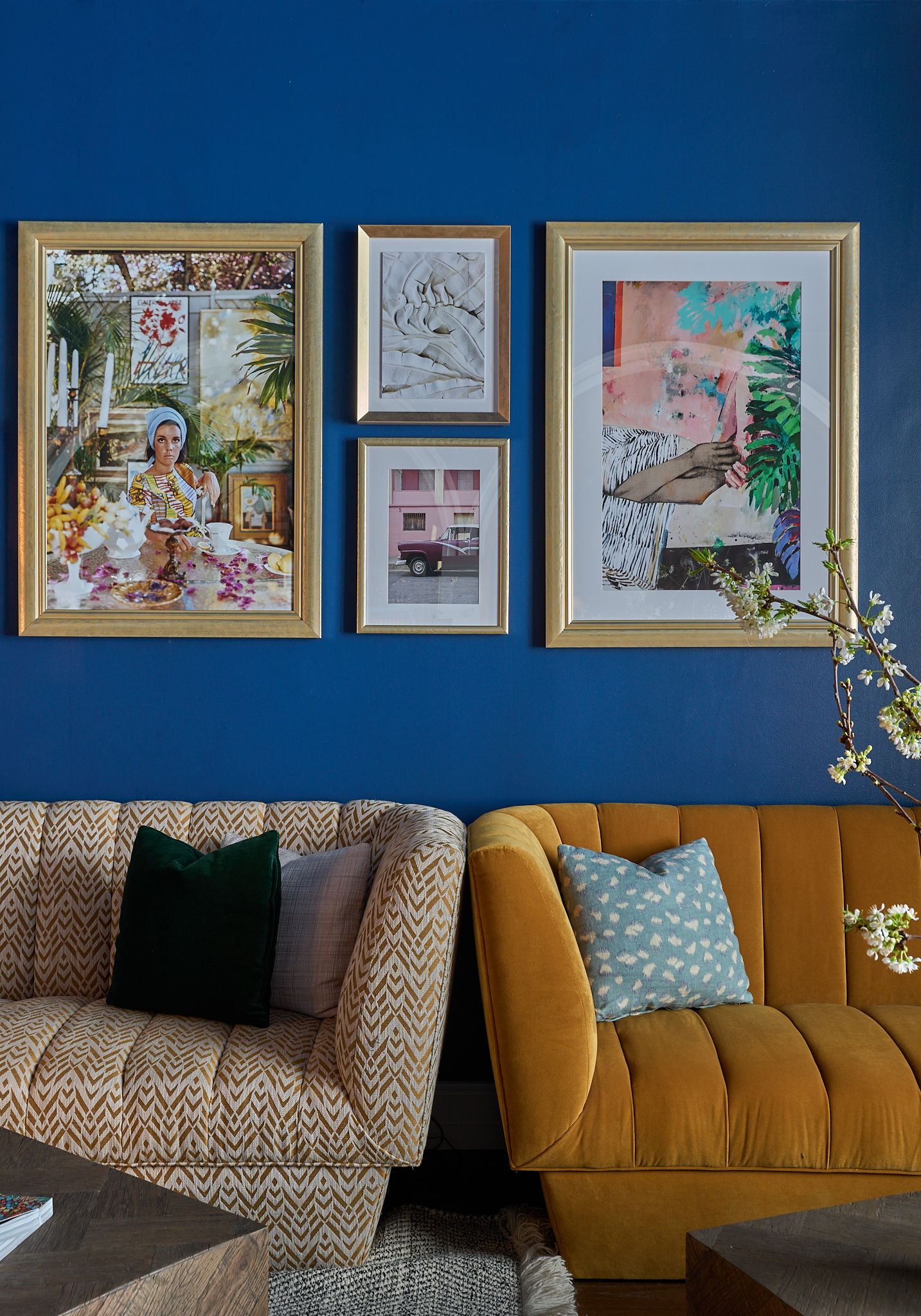 The reception at the Georgian Hotel in Santa Monica, LA. Interior Design by Fettle Design. Blue wall with pictures and textured sofas