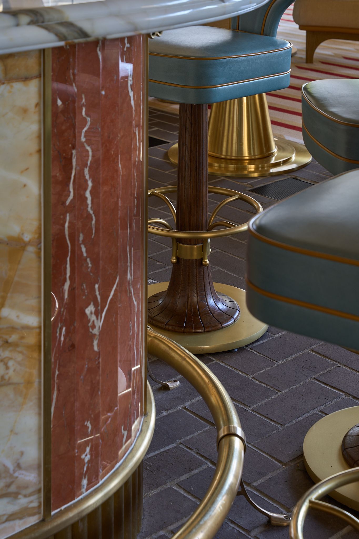 Bar detail with yellow and red marble, Bar Sprezzatura in San Francisco, CA