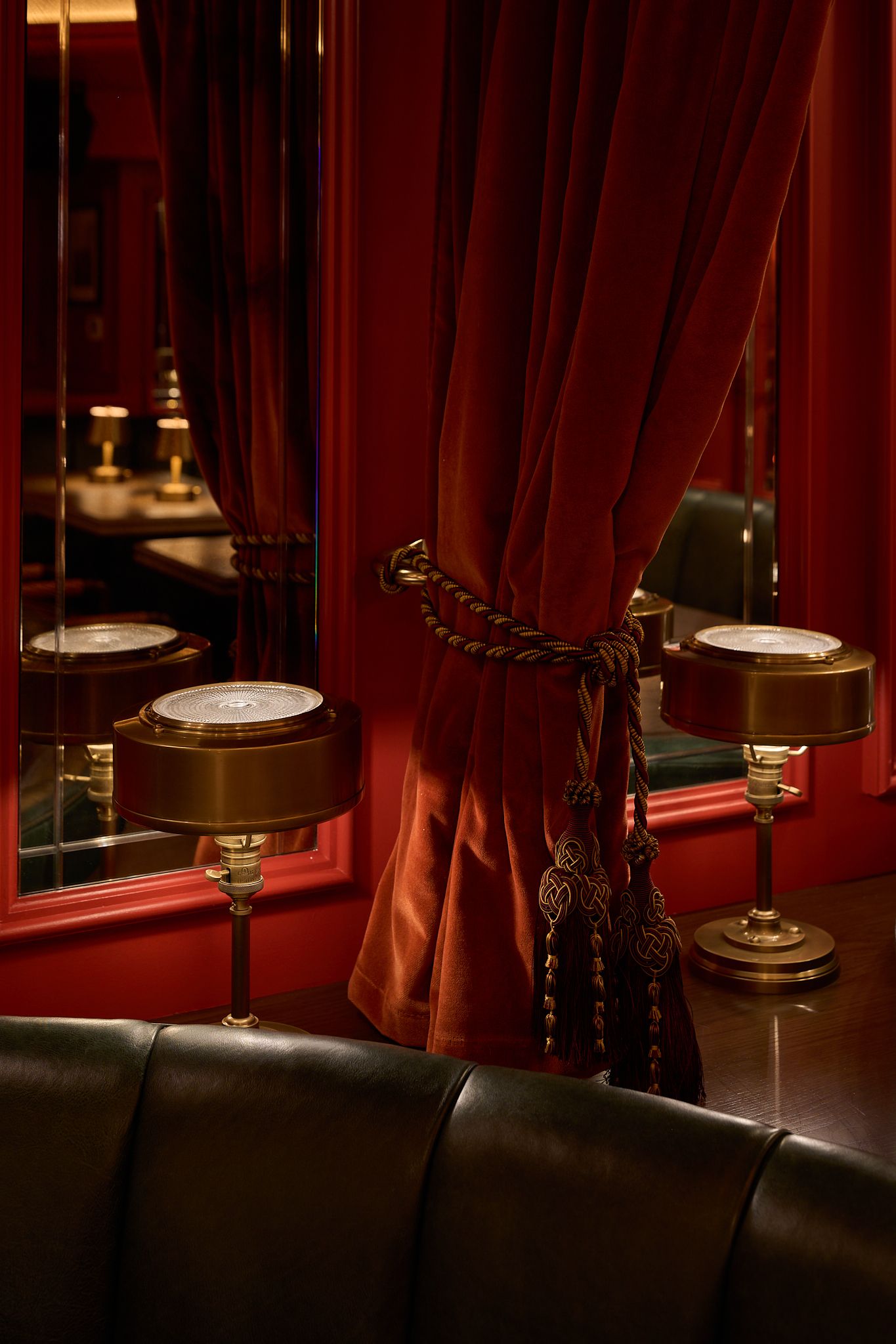 The dining room at the Georgian Hotel in Santa Monica, LA. Interior Design by Fettle Design. Moody detailed photo of lighting and curtain.