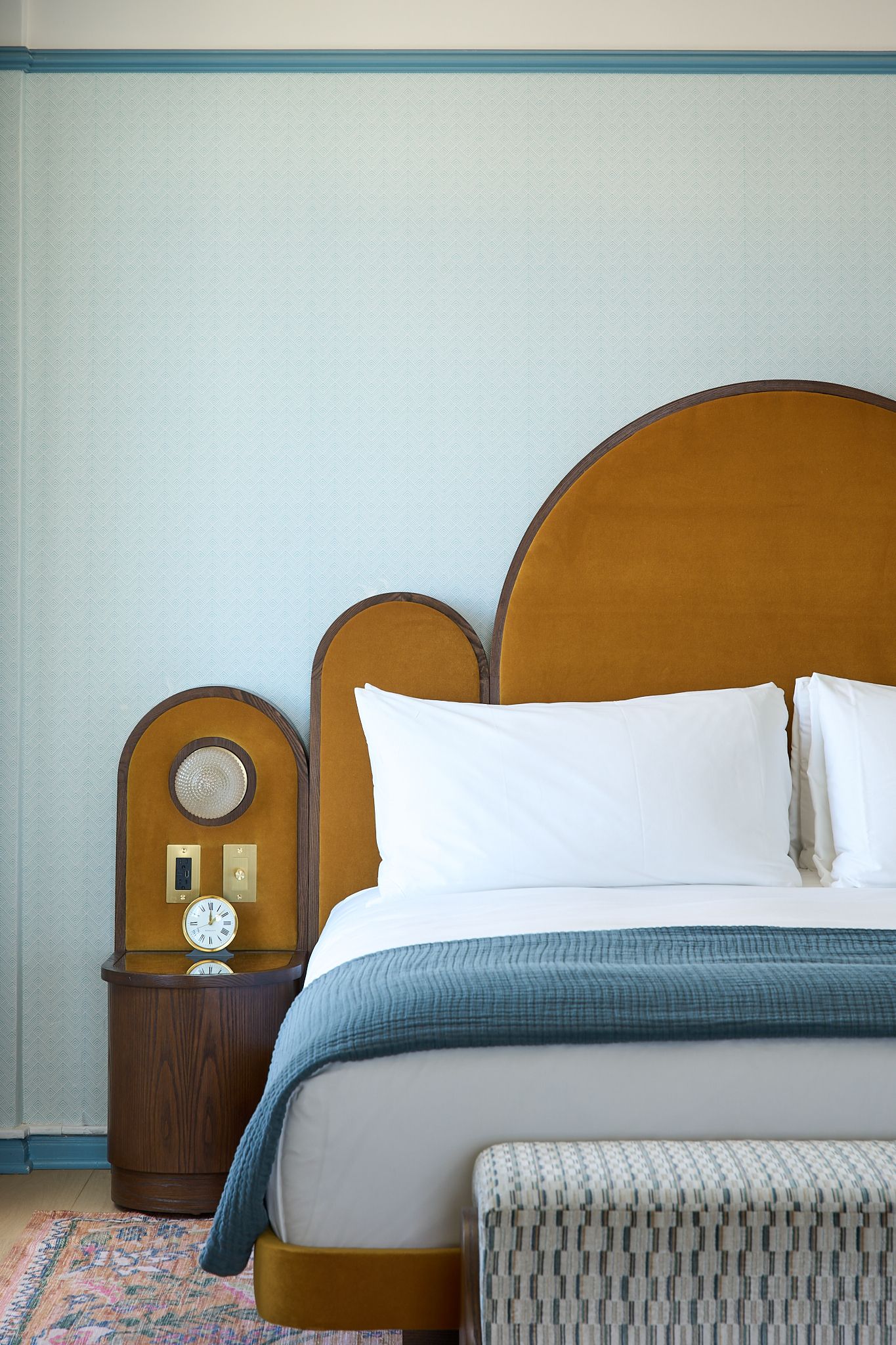 The guestroom at the Georgian Hotel in Santa Monica, LA. Interior Design by Fettle Design. Yellow fabric and nightstand