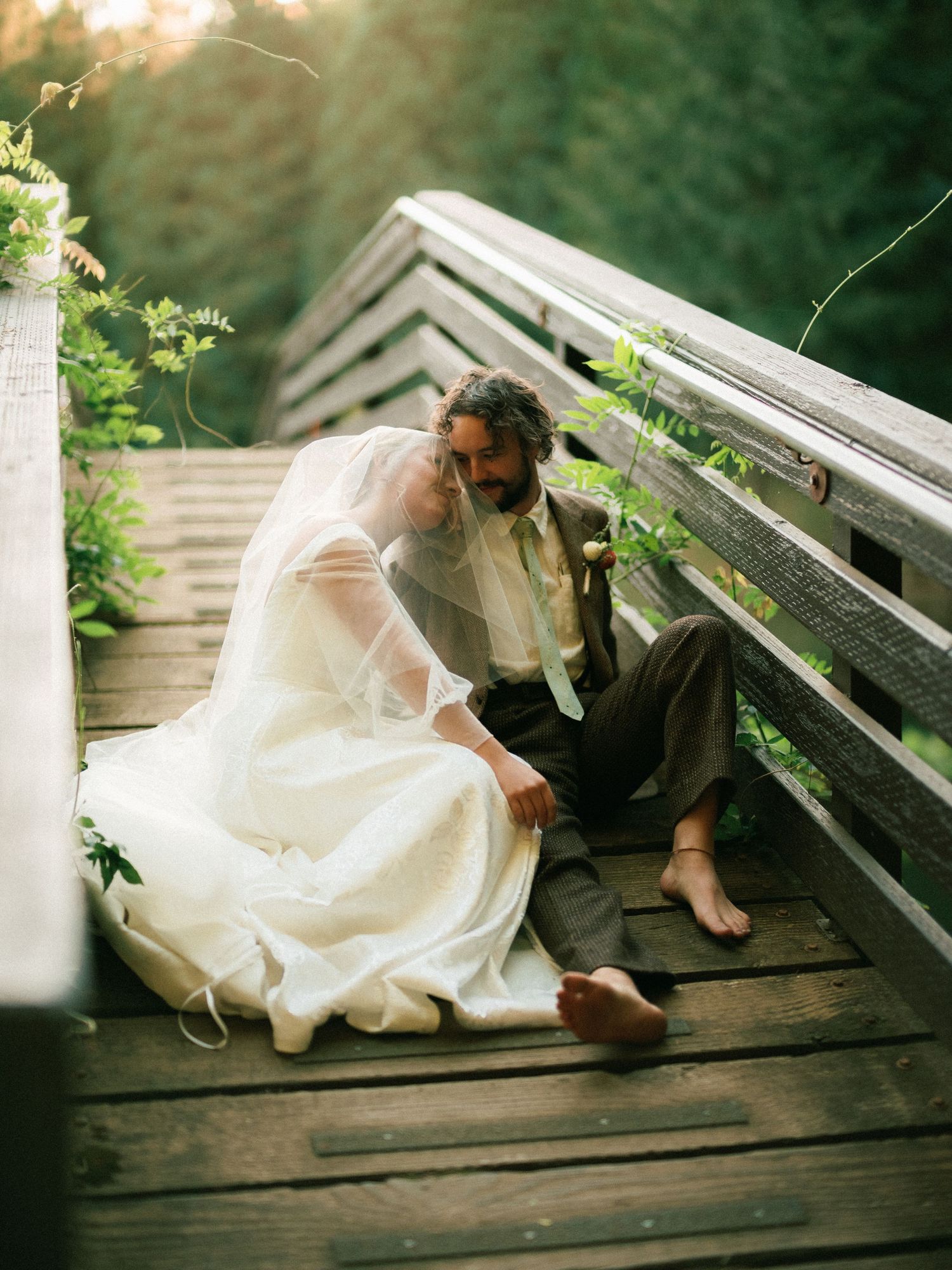 A peaceful moment on wooden stairs surrounded by greenery.