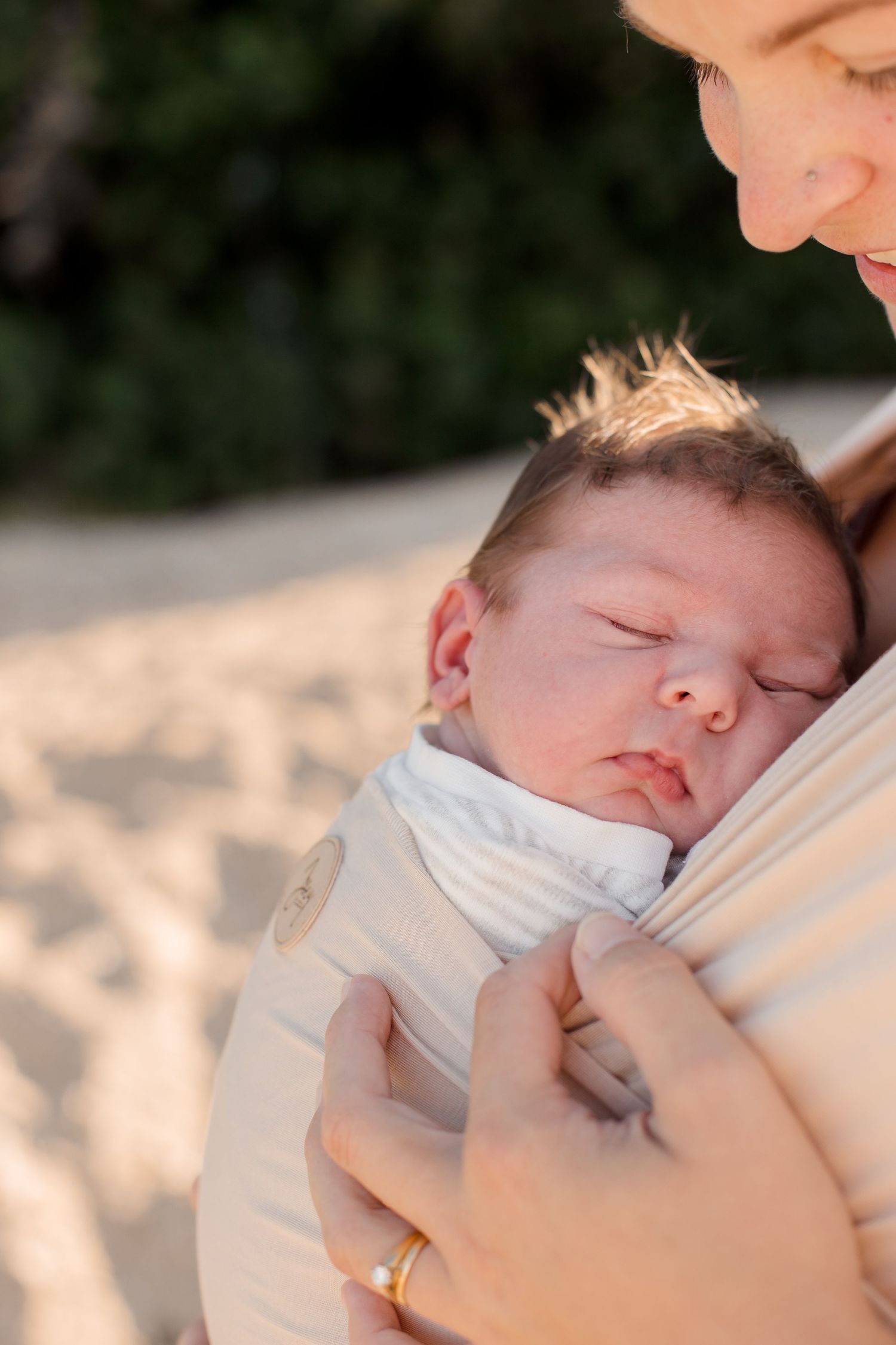 Tender moment captured on sandy beach at sunset.