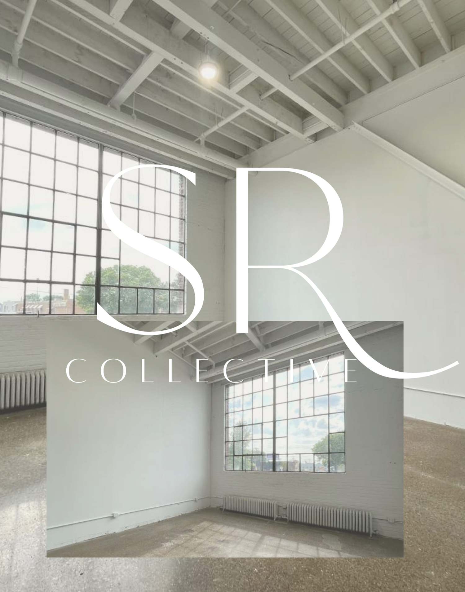 Large industrial interior space with high ceilings, white painted walls, concrete floors and tall windows providing natural light.