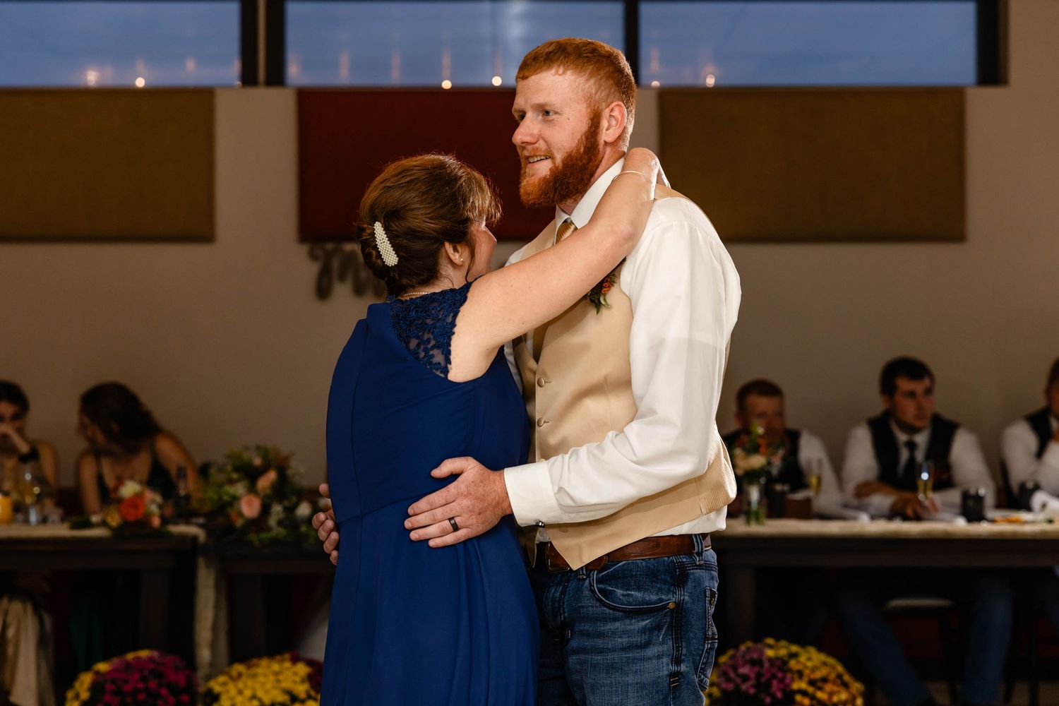 A tender dance moment during wedding reception festivities.