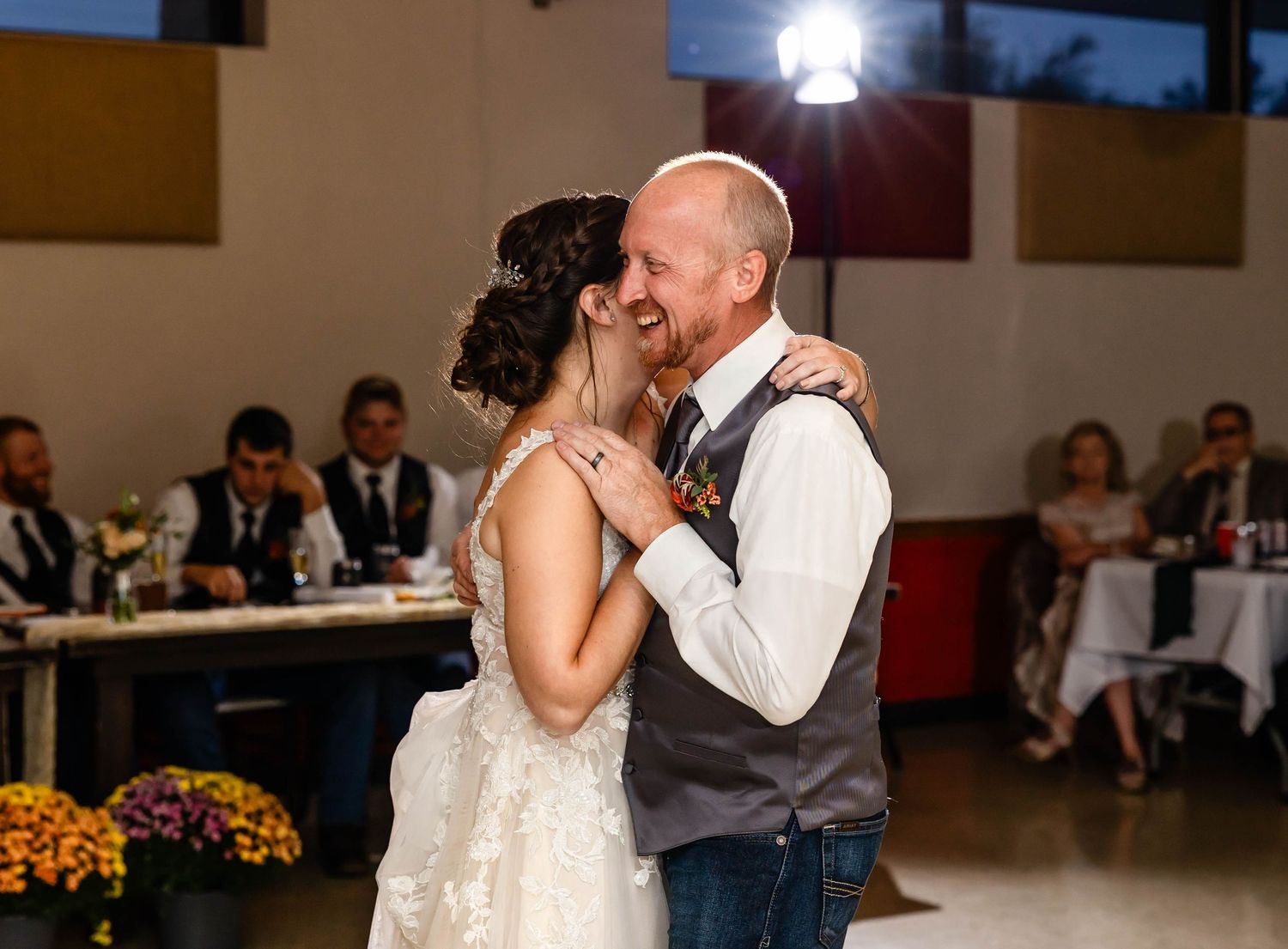 A tender moment shared between newlyweds during their wedding dance.