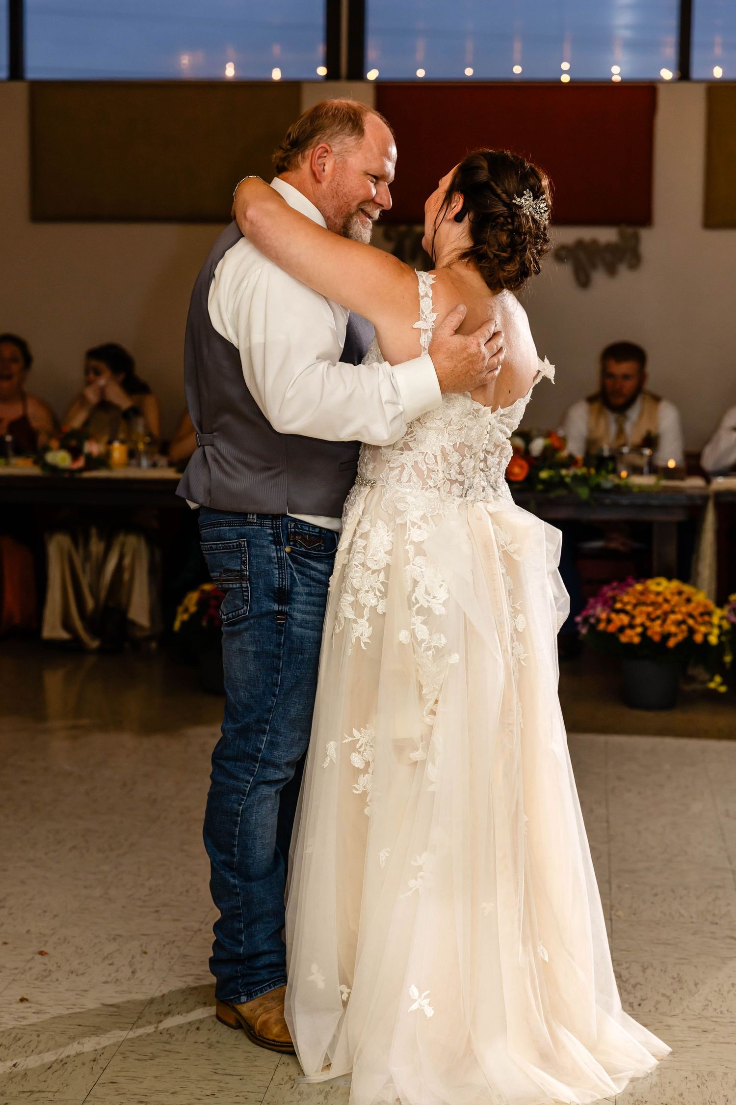 Newlyweds share a romantic dance moment at their reception venue.