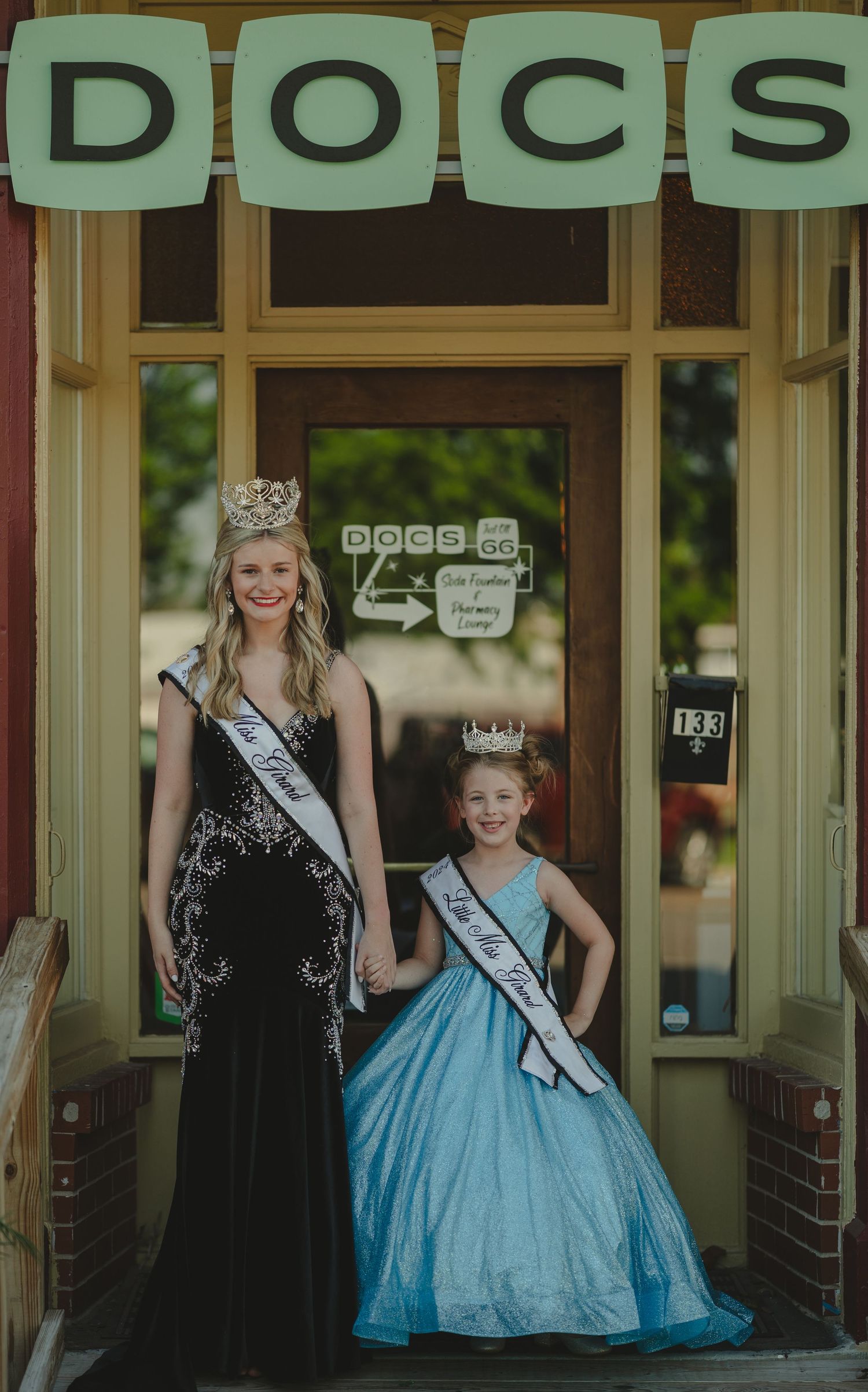 Miss Girard and Little Miss Girard pose outside of DOCS