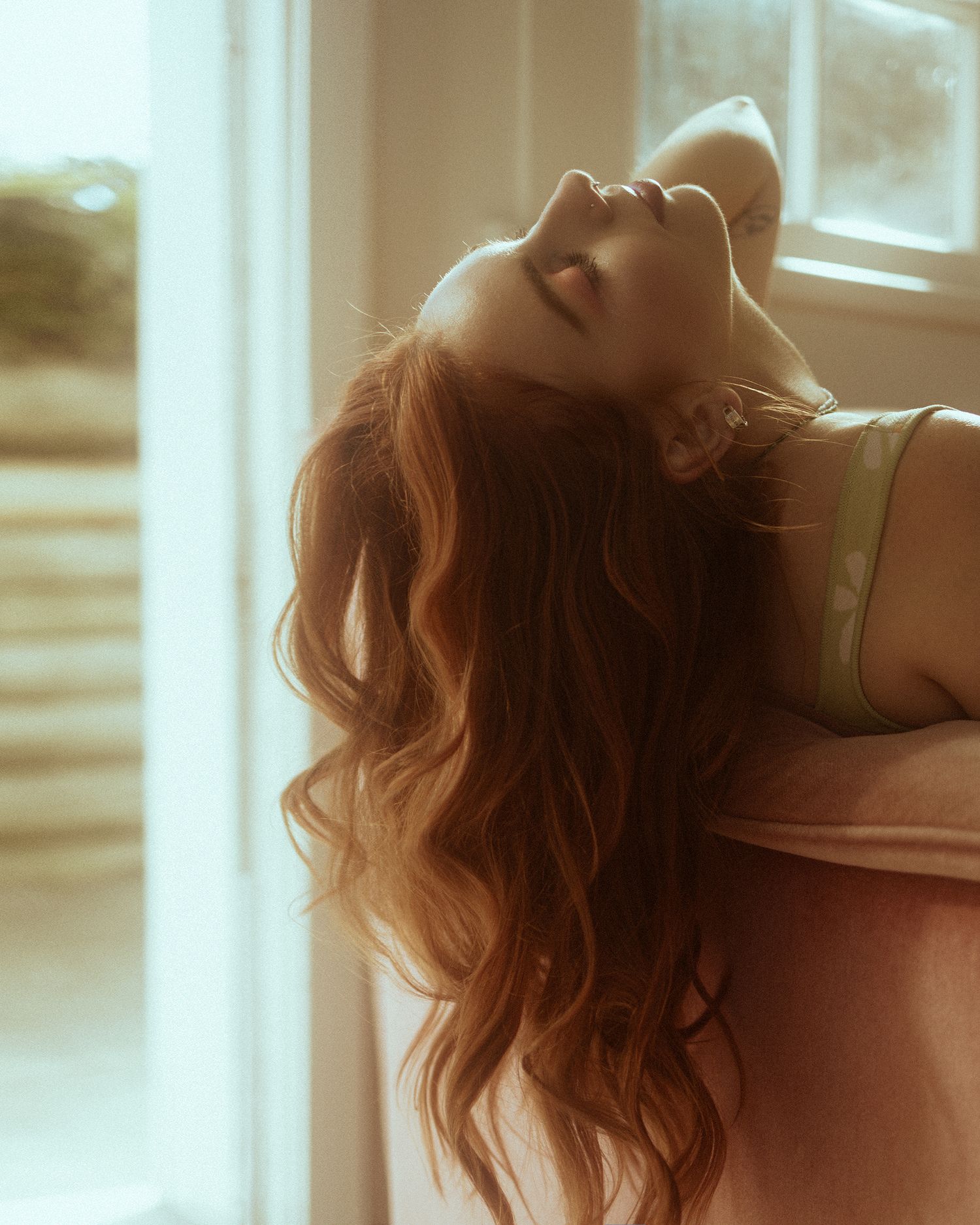 A dreamy portrait series shows a person with blonde wavy hair in soft sunlit close-up shots.