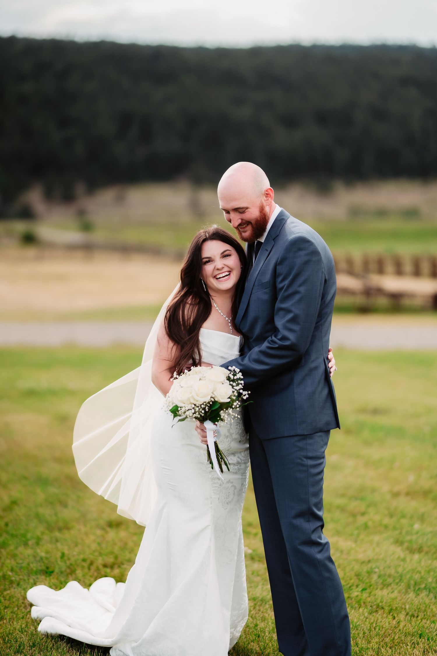 Candid wedding moments captured in sequence on a green field with mountain backdrop.