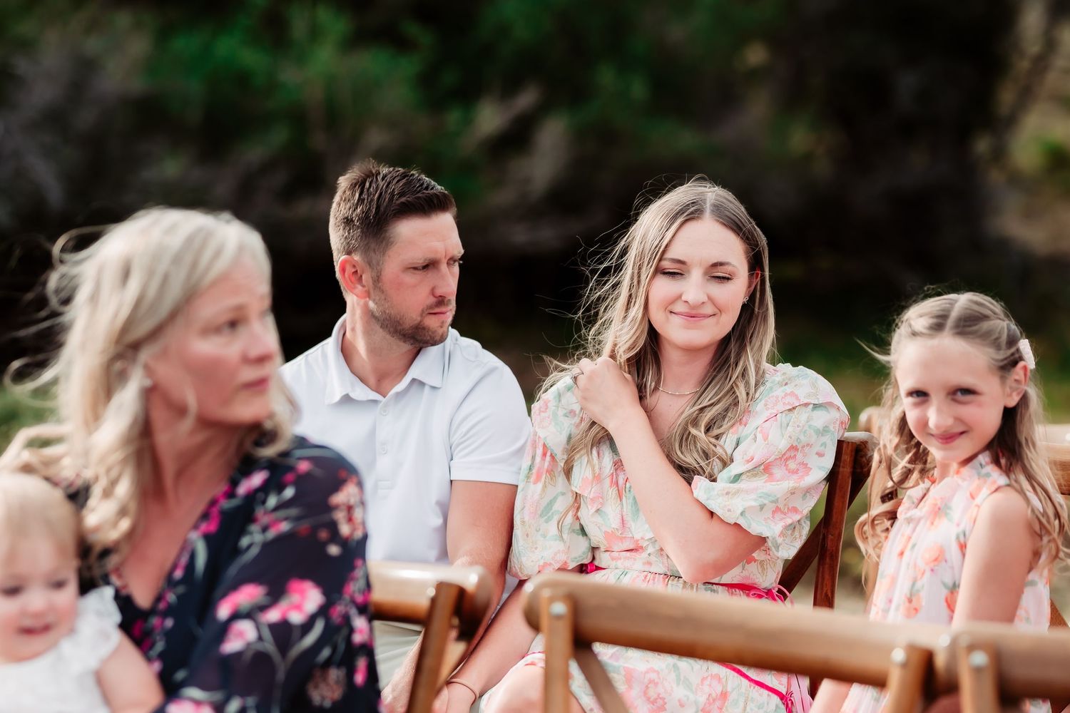 Wedding guests seated at outdoor tables during an intimate celebration.