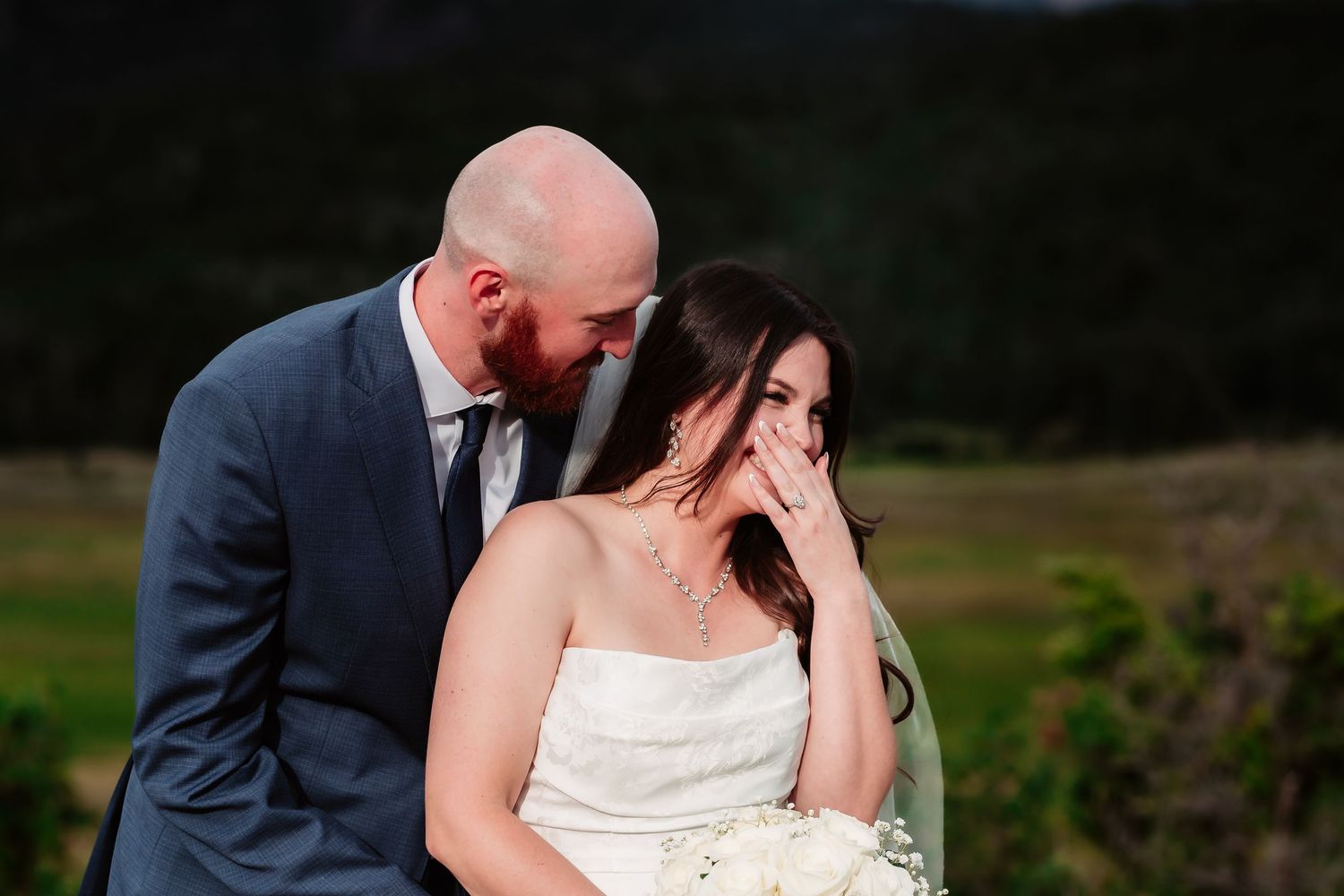 Intimate wedding portrait captured at scenic mountain overlook.
