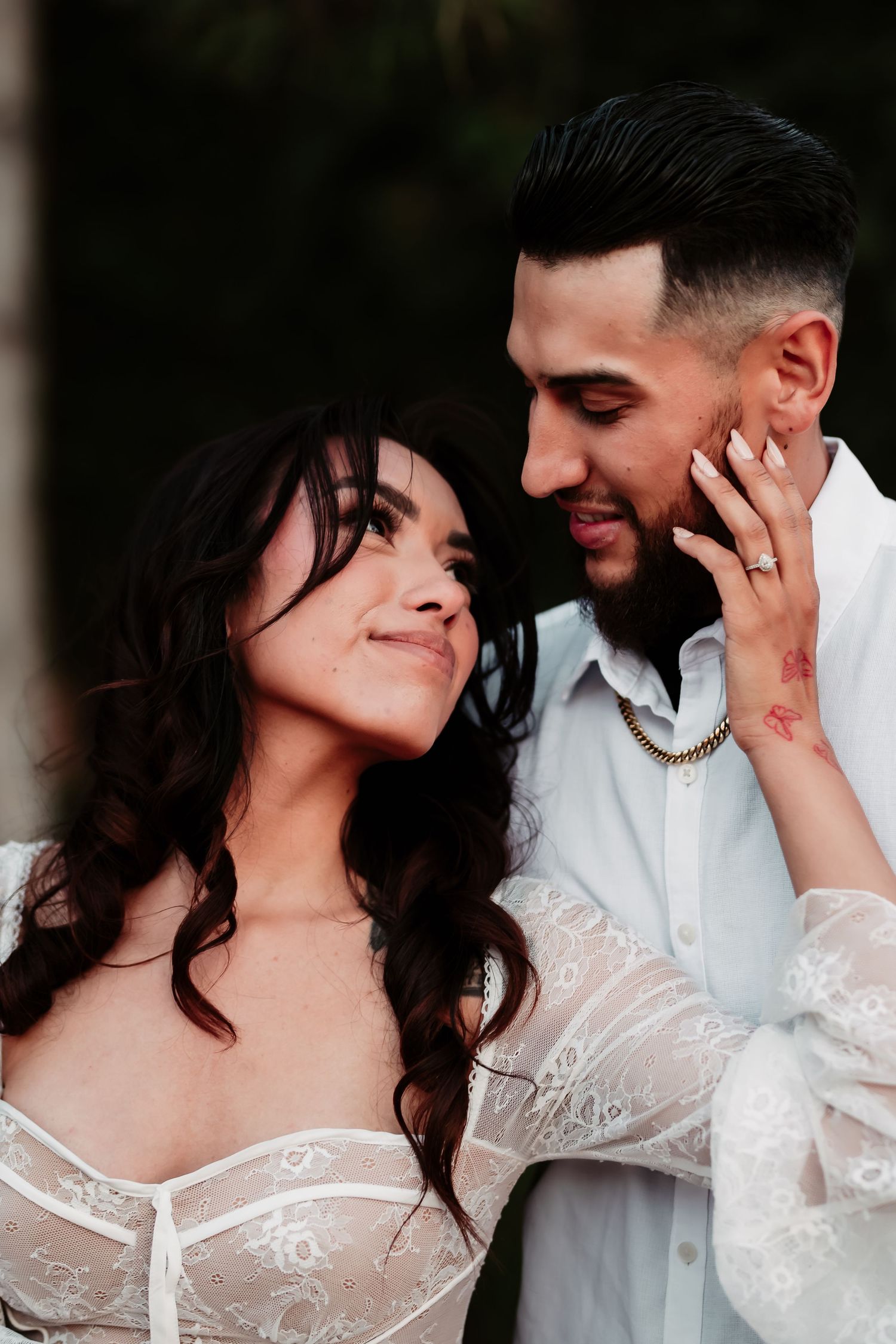 A romantic portrait sequence of a couple in an intimate pose against a dark background.