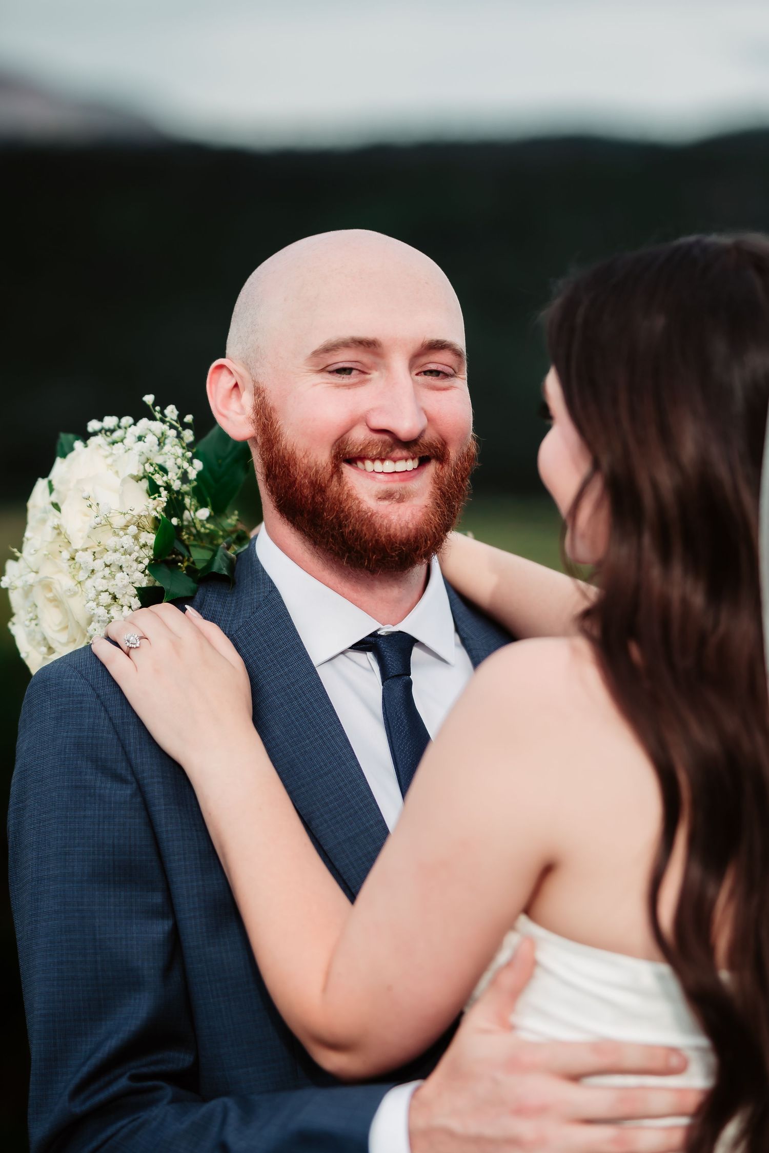 A romantic wedding couple shares intimate moments captured in a series of close-up photos against a blurred background.