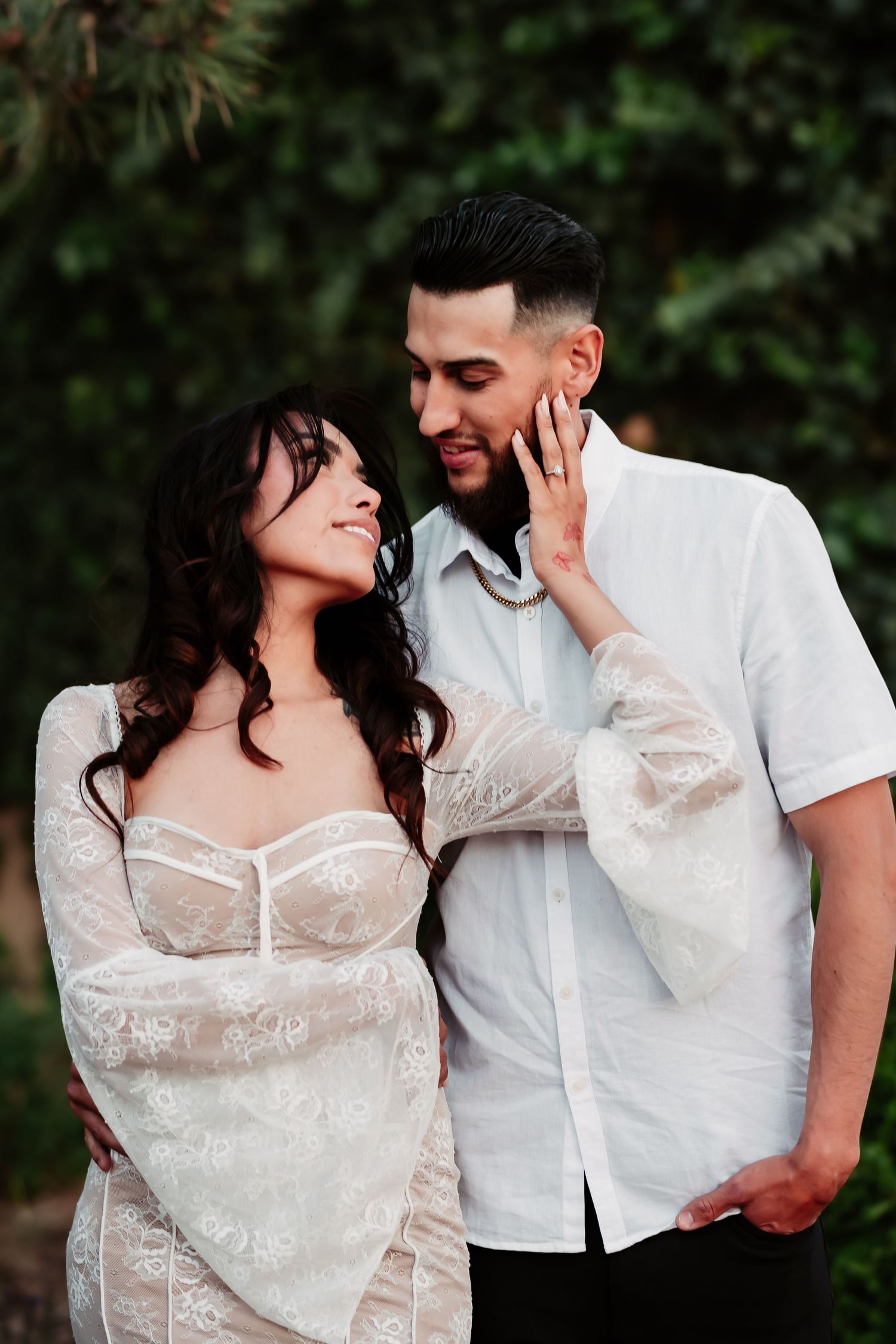 A romantic outdoor portrait session with a couple in white attire.
