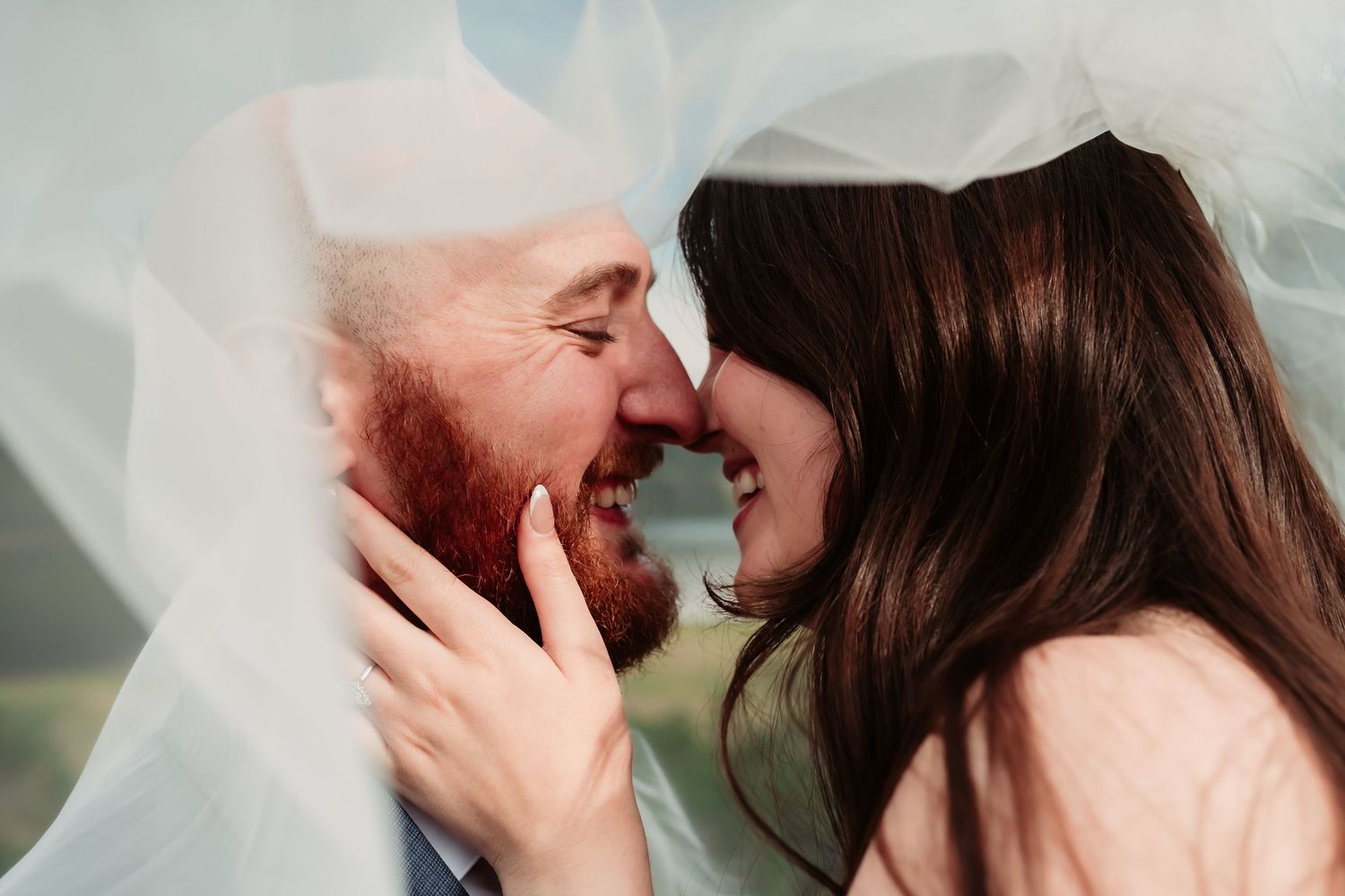 Close-up emotional moments during an outdoor waterfront wedding ceremony.
