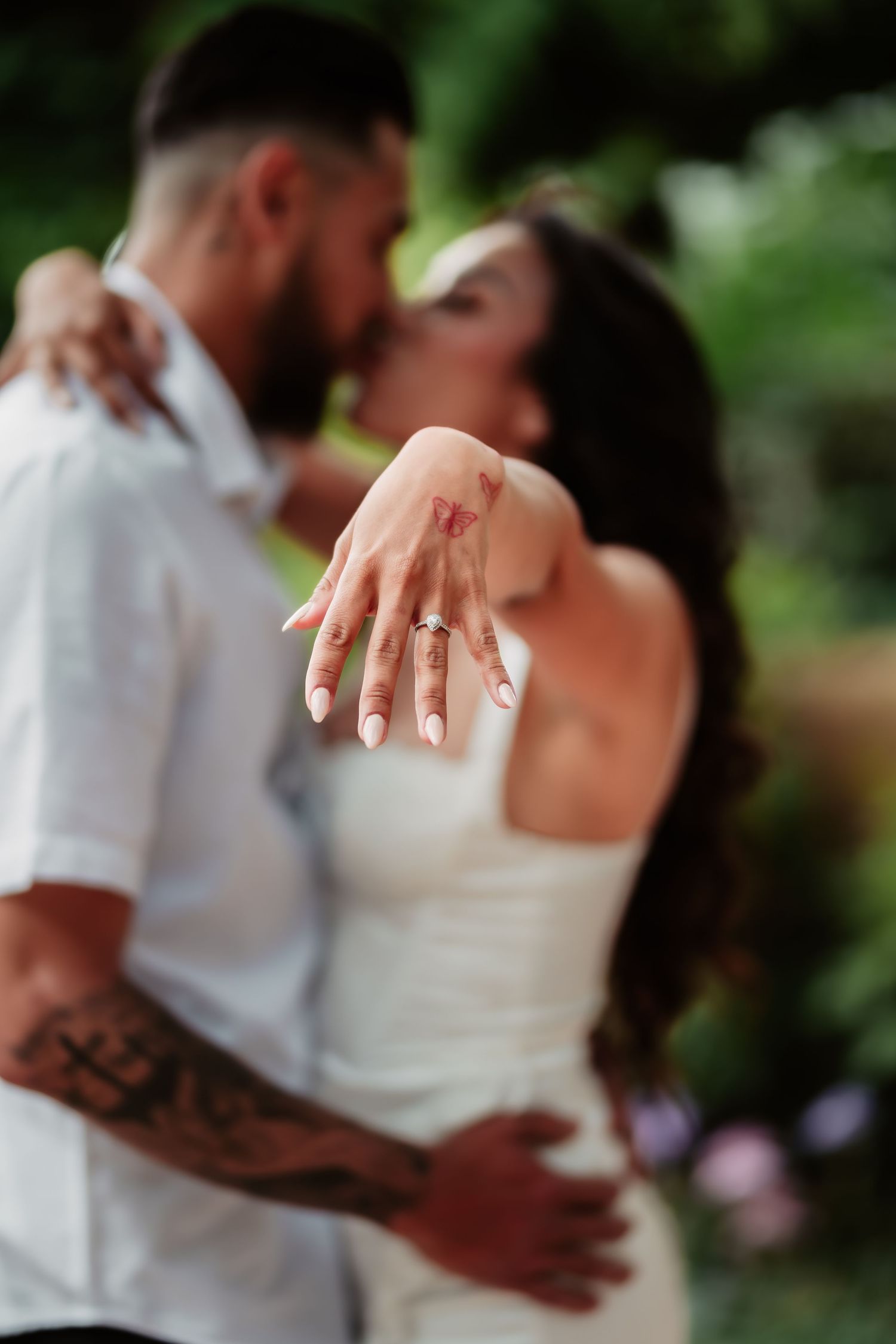 Close-up detail shots showing hands, embraces and romantic moments between a couple outdoors.
