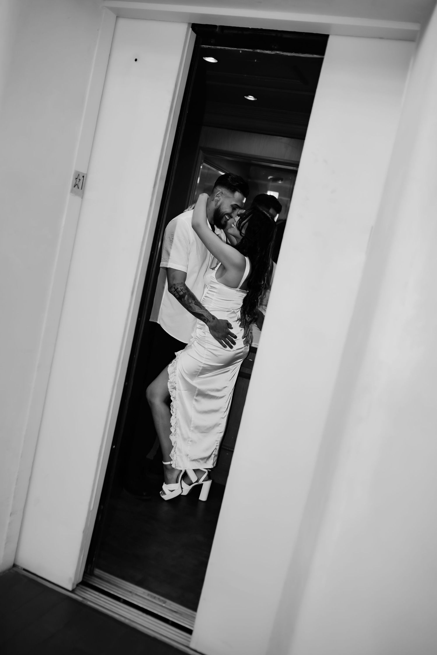 A black and white photo sequence showing a couple playfully entering through a doorway.