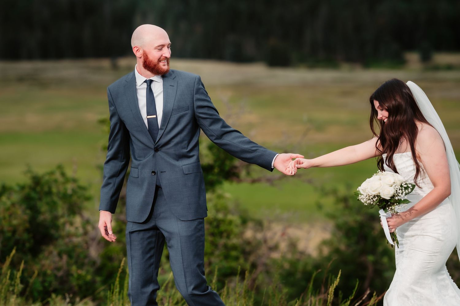 Couple shares candid moments during their mountain wedding photoshoot.