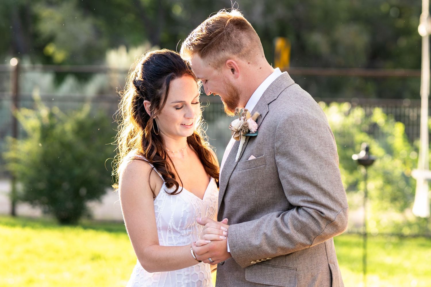Newlyweds share a tender moment during their first dance on their wedding day.