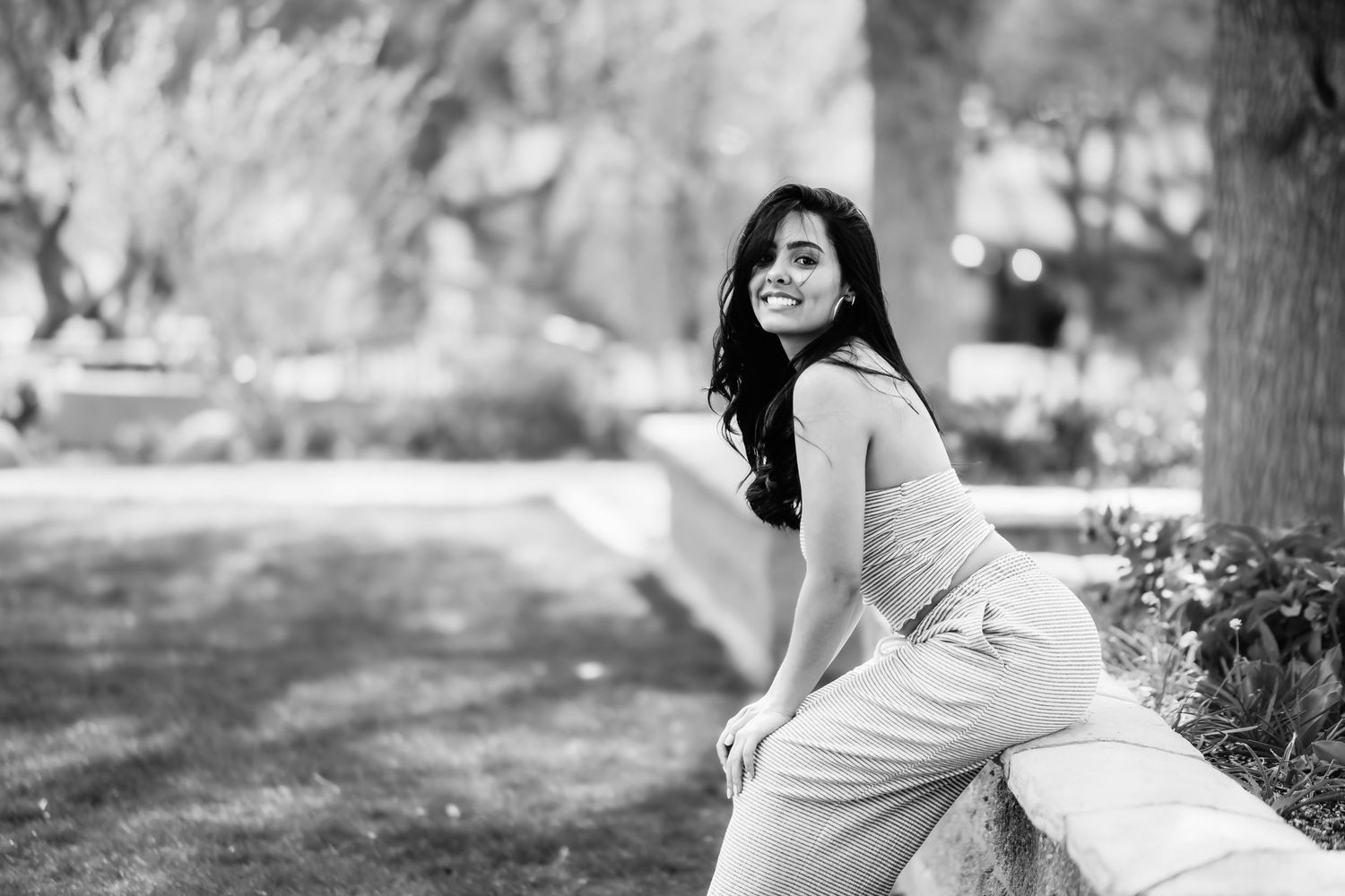 Black and white candid shot showing natural movement in outdoor setting.