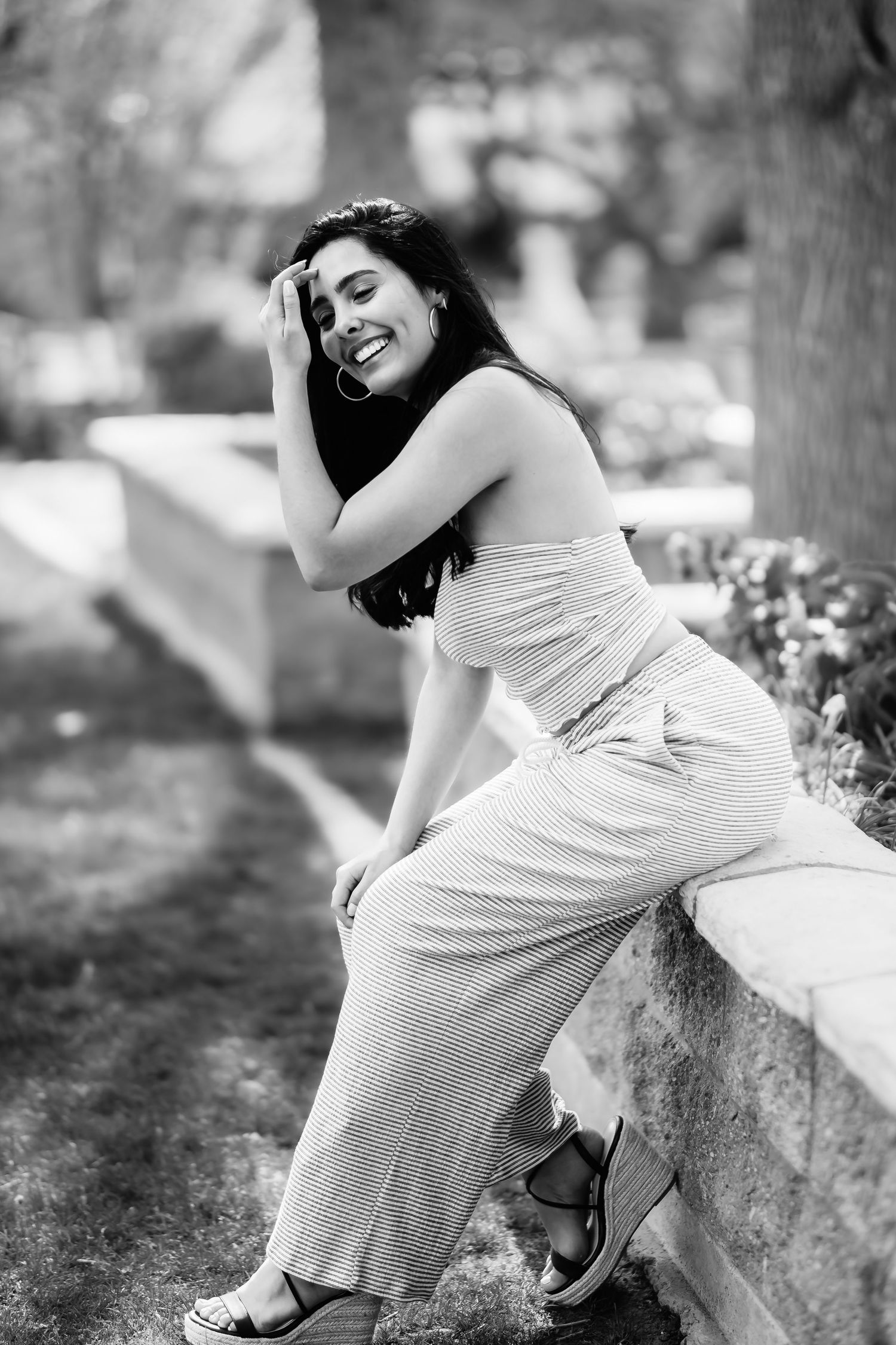 Black and white portrait capturing candid laughter and joy.