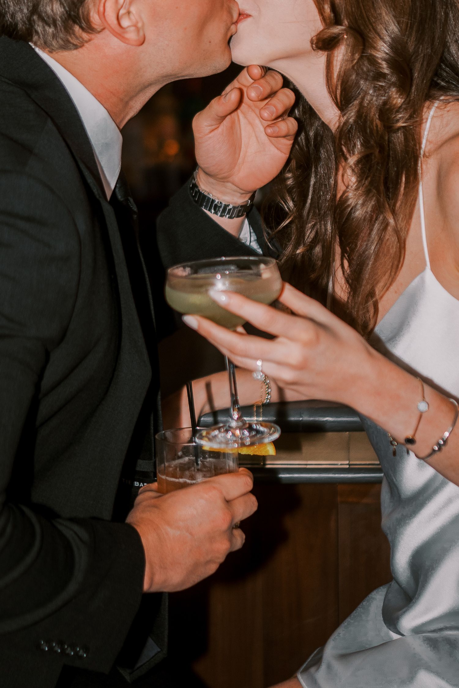Romantic collage of a couple feeding each other dessert, captured in intimate closeup shots at a dimly lit restaurant.