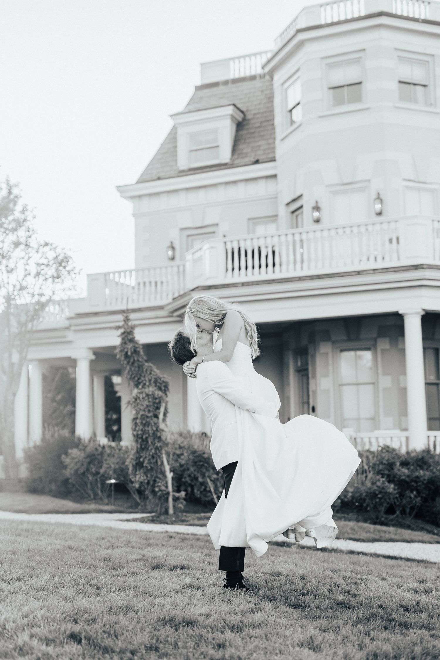 Four vintage black and white photographs show a ghostly figure running through a lawn outside a grand white mansion.