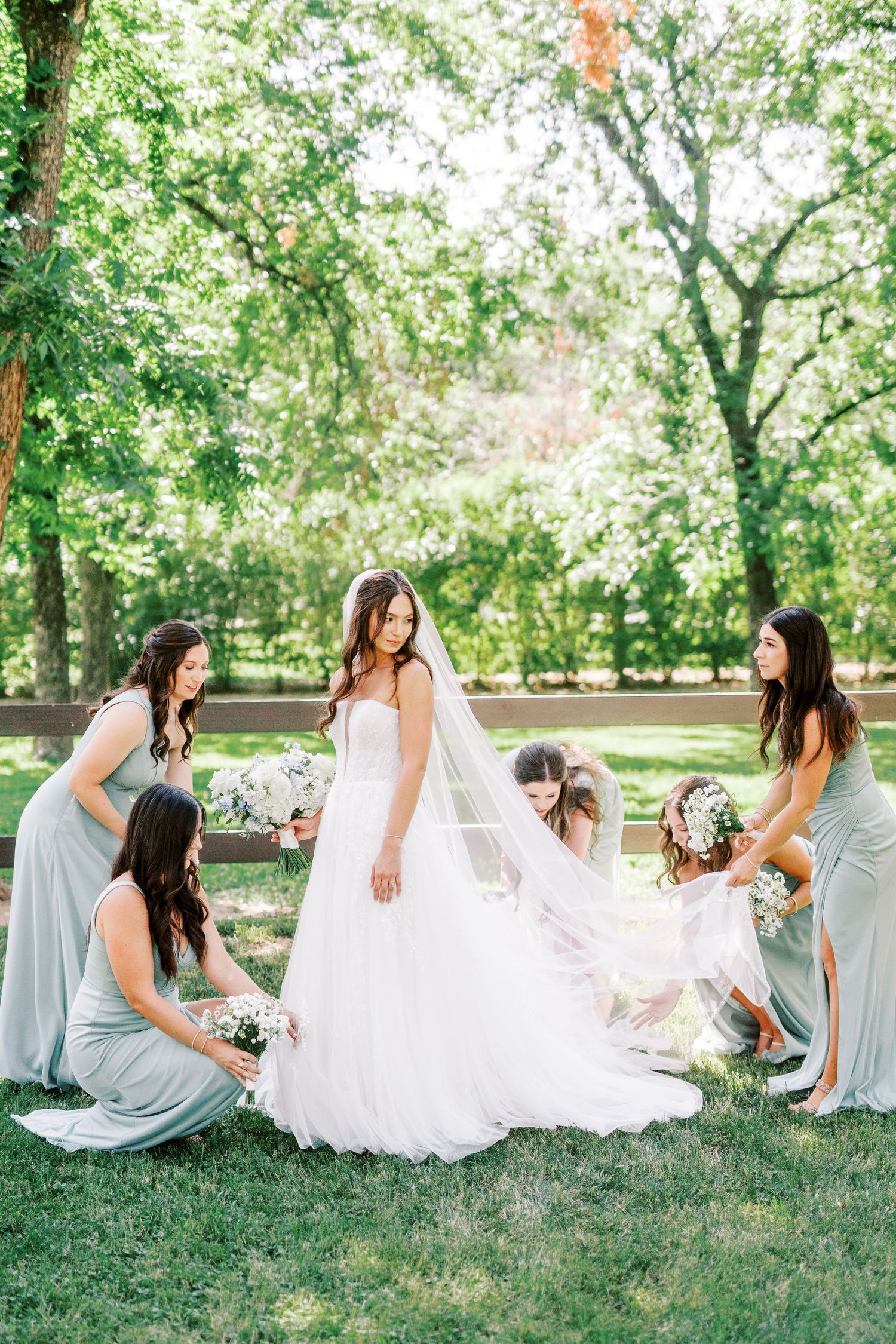 A sequence of elegant photos showing soft mint green bridesmaids helping adjust a white wedding dress on grass.