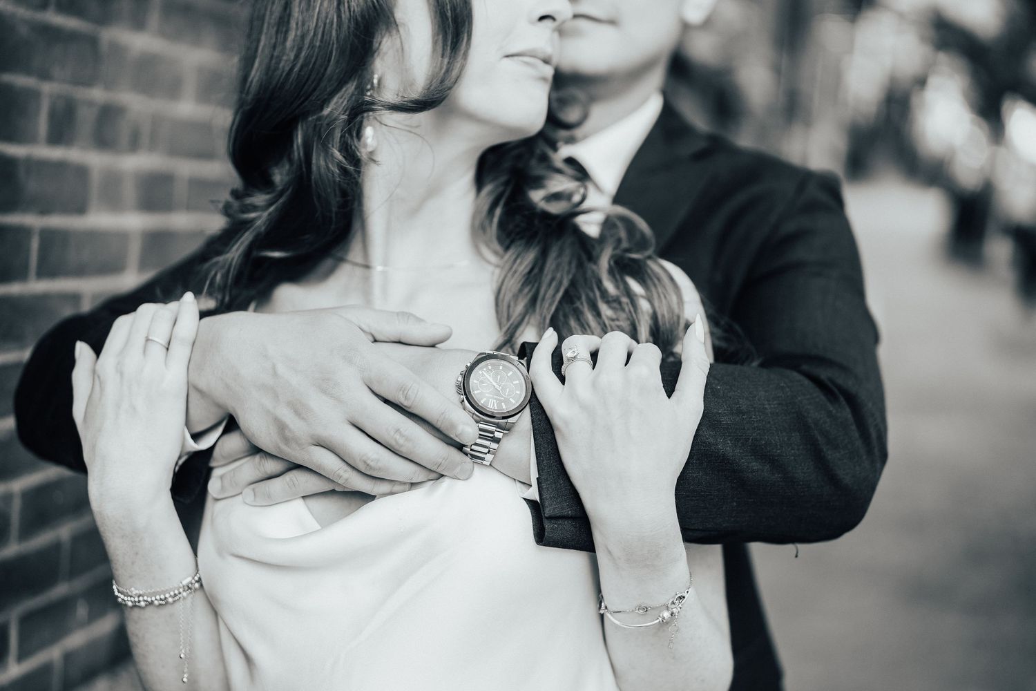 A romantic black and white wedding photo sequence showing newlyweds sharing intimate moments outdoors.
