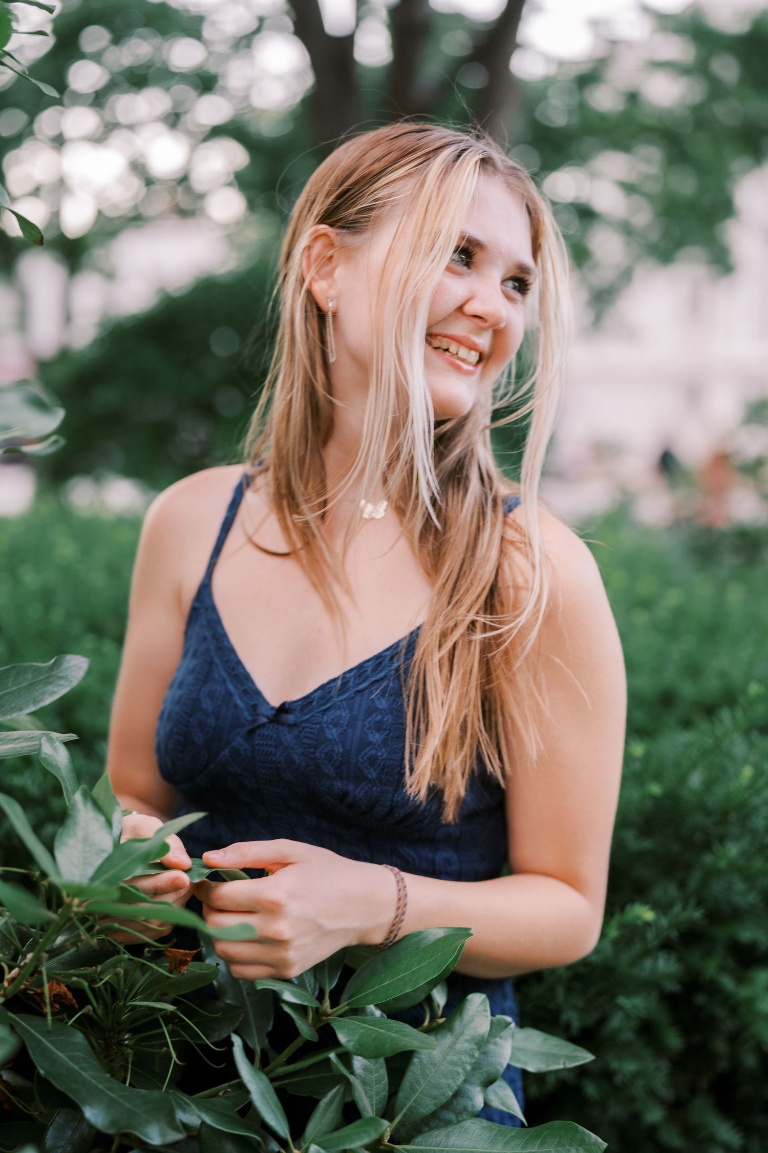 A series of casual outdoor portraits showing joyful expressions among green foliage and plants.