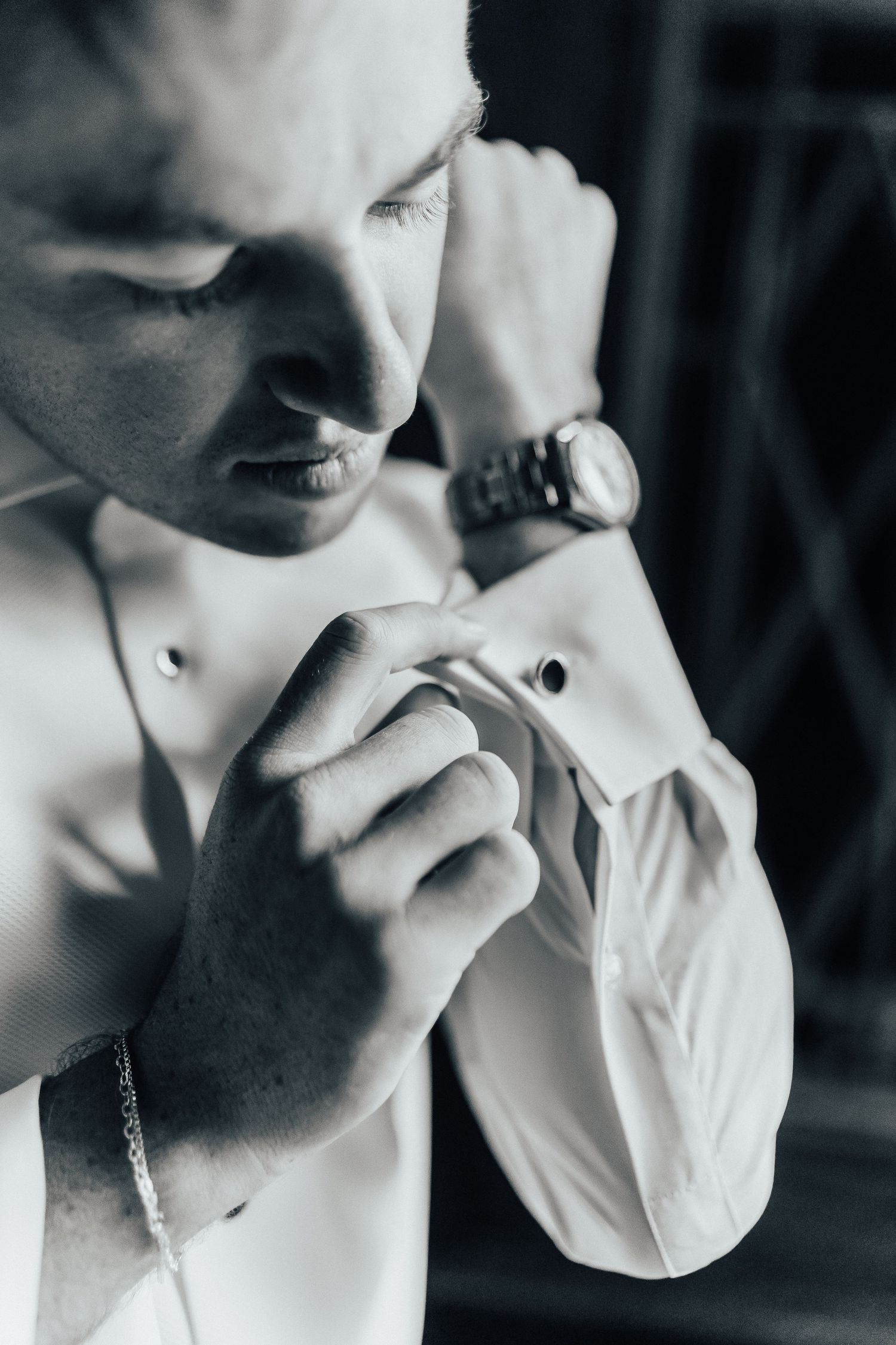 Black and white photo series showing delicate hand gestures against a white background captured in dramatic lighting.