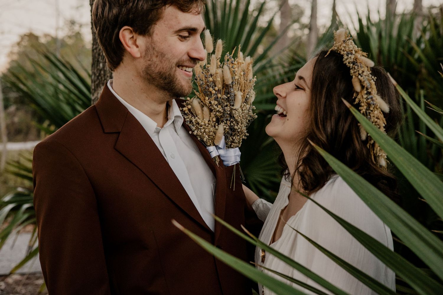wedding couple laughing together after their ceremony