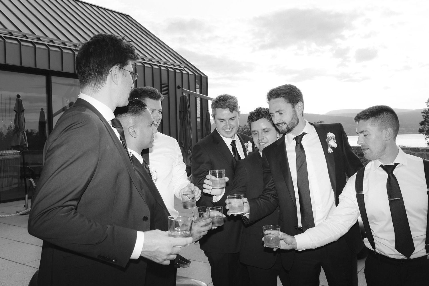 A series of black and white photos showing business professionals interacting in office and meeting settings.